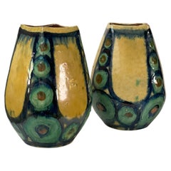 A pair of green and yellow vases