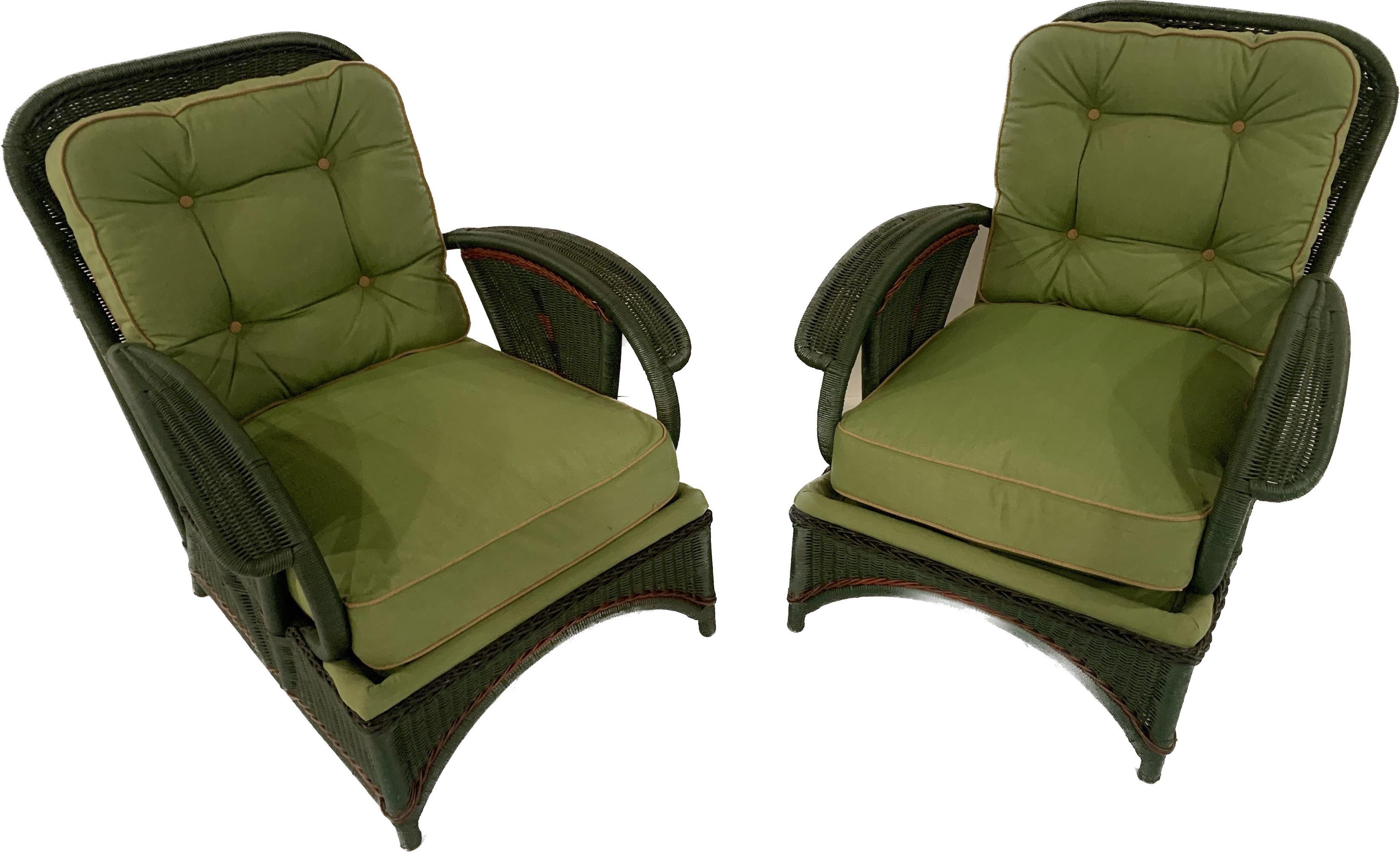 A matched pair of Antique Art Deco Style Wicker Lounge Chairs, American, C. 1920s. These chairs were the height of fashion in the 1920s. Painted reed furniture was all the rage for a short period with their dramatic design shapes and colorful