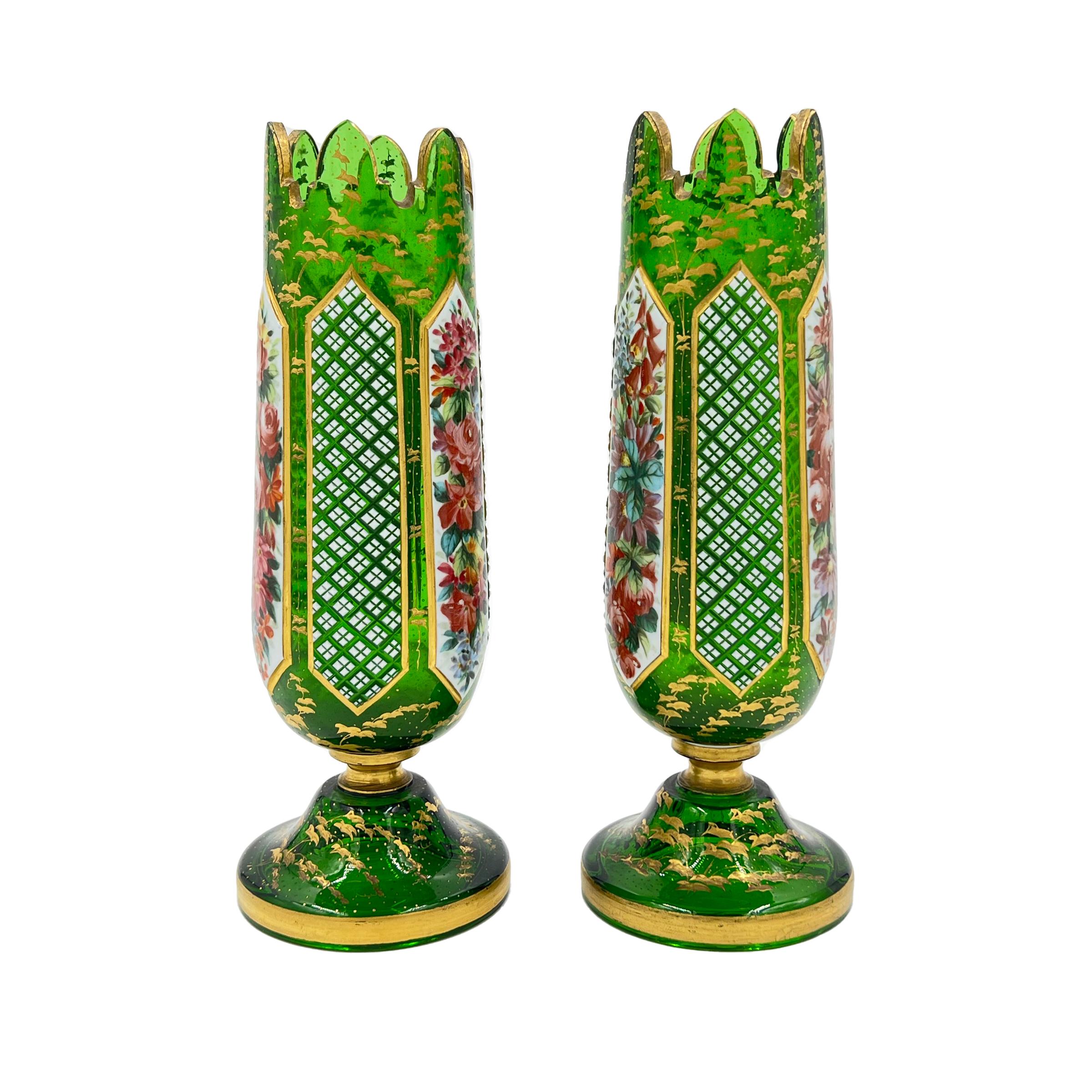A pair of 19th century bohemian flashed glass vases for the Persian/Oriental market, decorated with white overlay glass panels painted profusely with flowers, interspersed with diamond cut panels, raised on domed feet with gilt decoration of