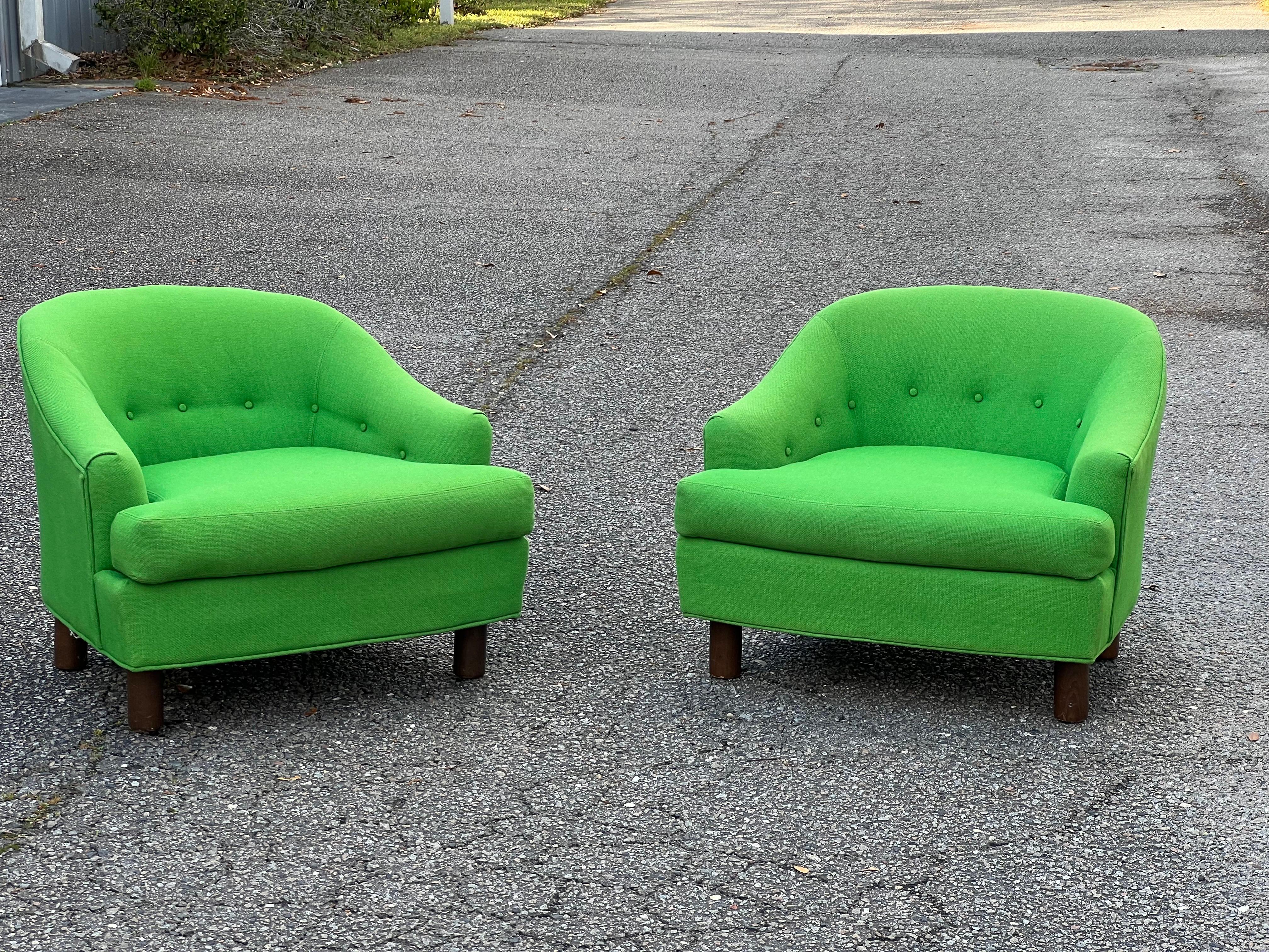 1960s Vintage Selig of Monroe Mid-Century Modern Barrel Back Club Chairs - a Pair

A fabulous pair of my favorite color green barrel back club chairs with button tufted backs a loose cushion, sloping arms, and thick walnut legs.  Both chairs are