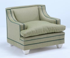 A pair of green two-tone upholstered club chairs circa 1950
