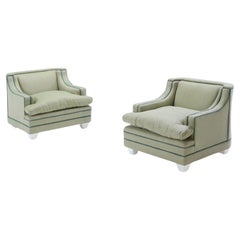 A pair of green two-tone upholstered club chairs circa 1950
