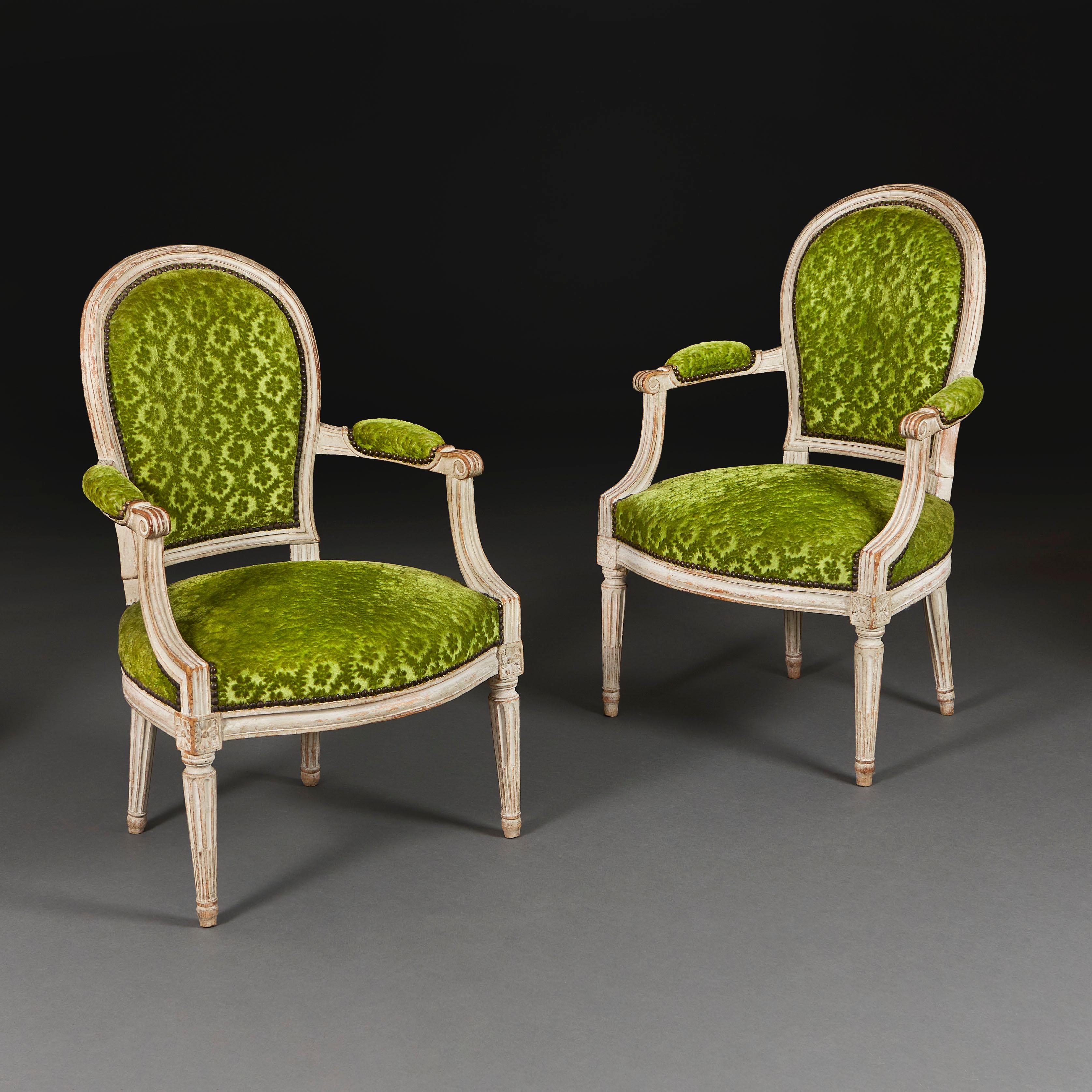 France, circa 1780

A pair of late eighteenth century painted fauteuils, with oval backs and seats, upholstered in striking nineteenth century apple green cut velvet, all supported on fluted tapering legs.

Height 87.00cm
Width 58.00cm
Depth