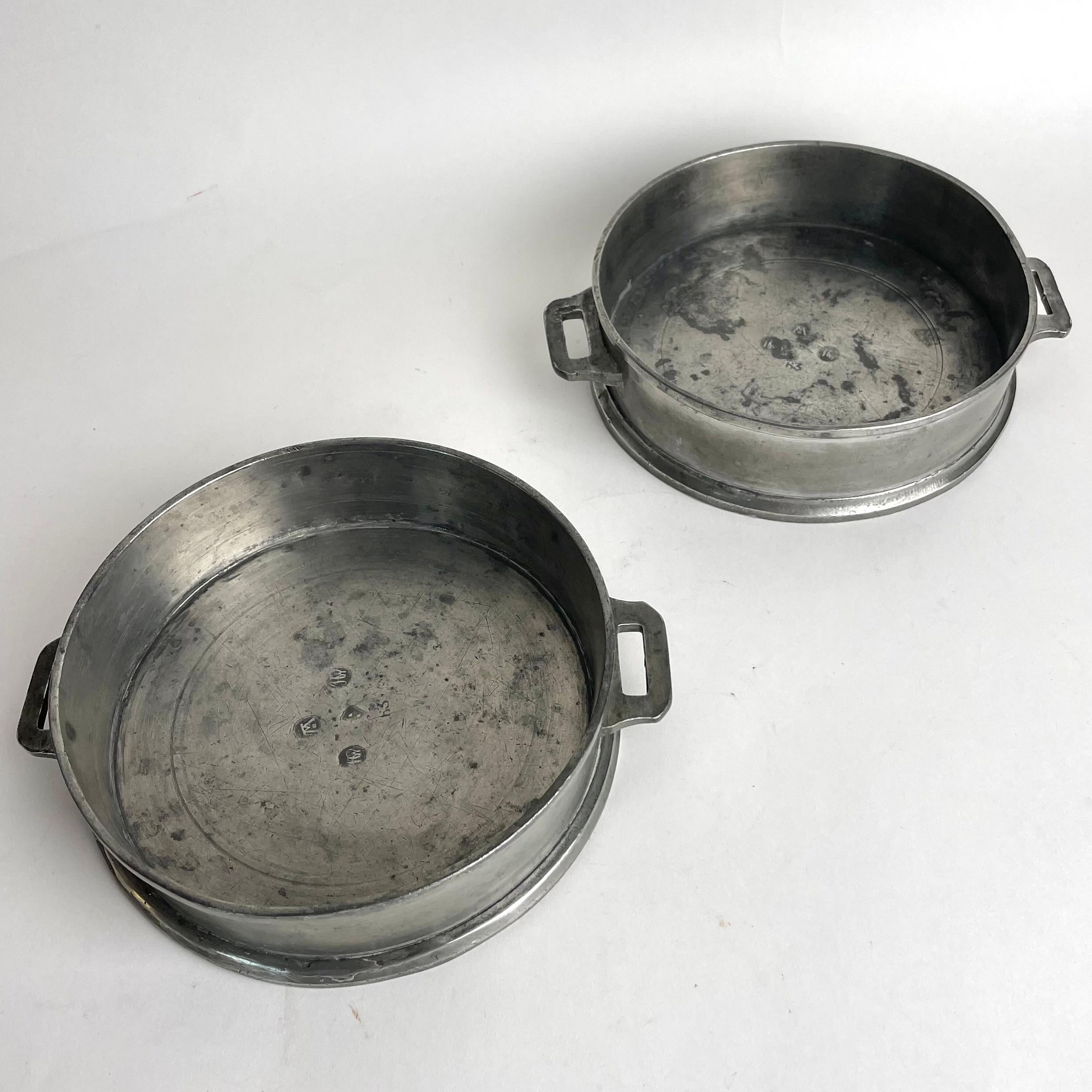 Swedish A pair of Gustavian Pewter magnum bottles Coasters dated 1808
