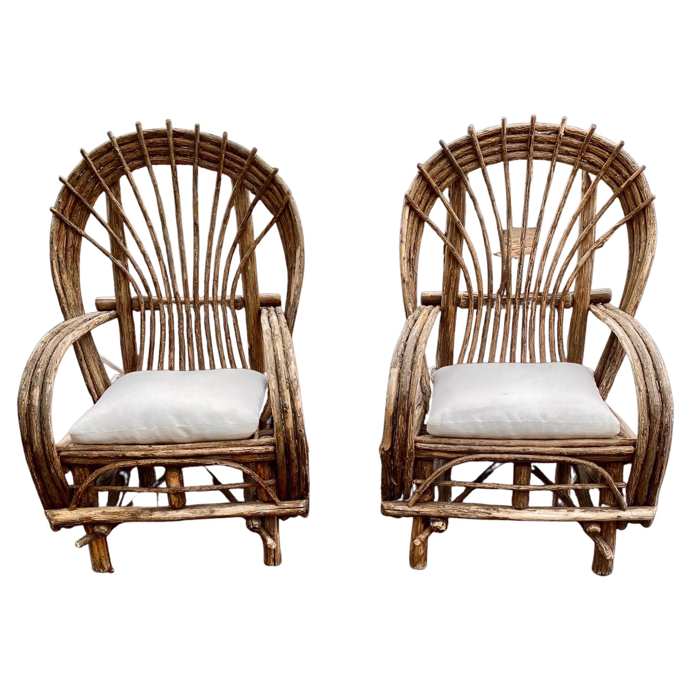 These fine old chairs made to grace an Adirondack lodge's deep porch or lawn were made in the 1920's. Made most likely on site at a lodge and found in Upstate New York they are constructed of willow limbs & twigs bent freehand, cut and screwed