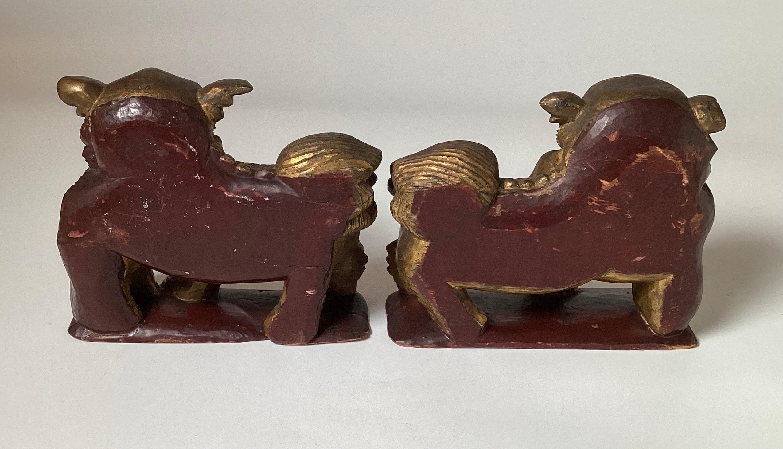 A Pair of Hand Carved Gilt Wood Chinese Export Foo Dogs  In Good Condition For Sale In Lambertville, NJ
