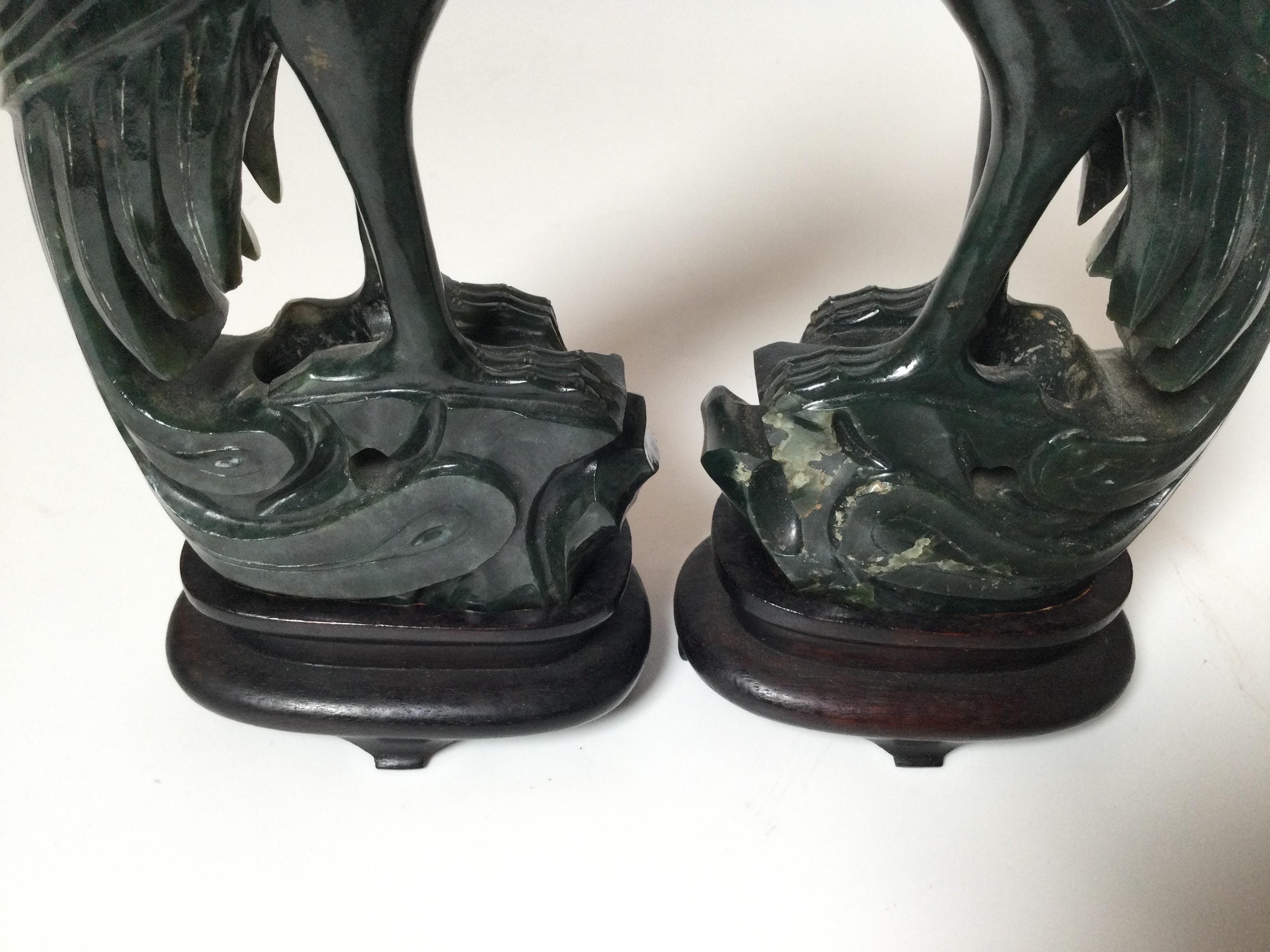 Chinese Pair of Hand Carved Spinach Jade Phoenix Bird Figures with Wood Stands For Sale
