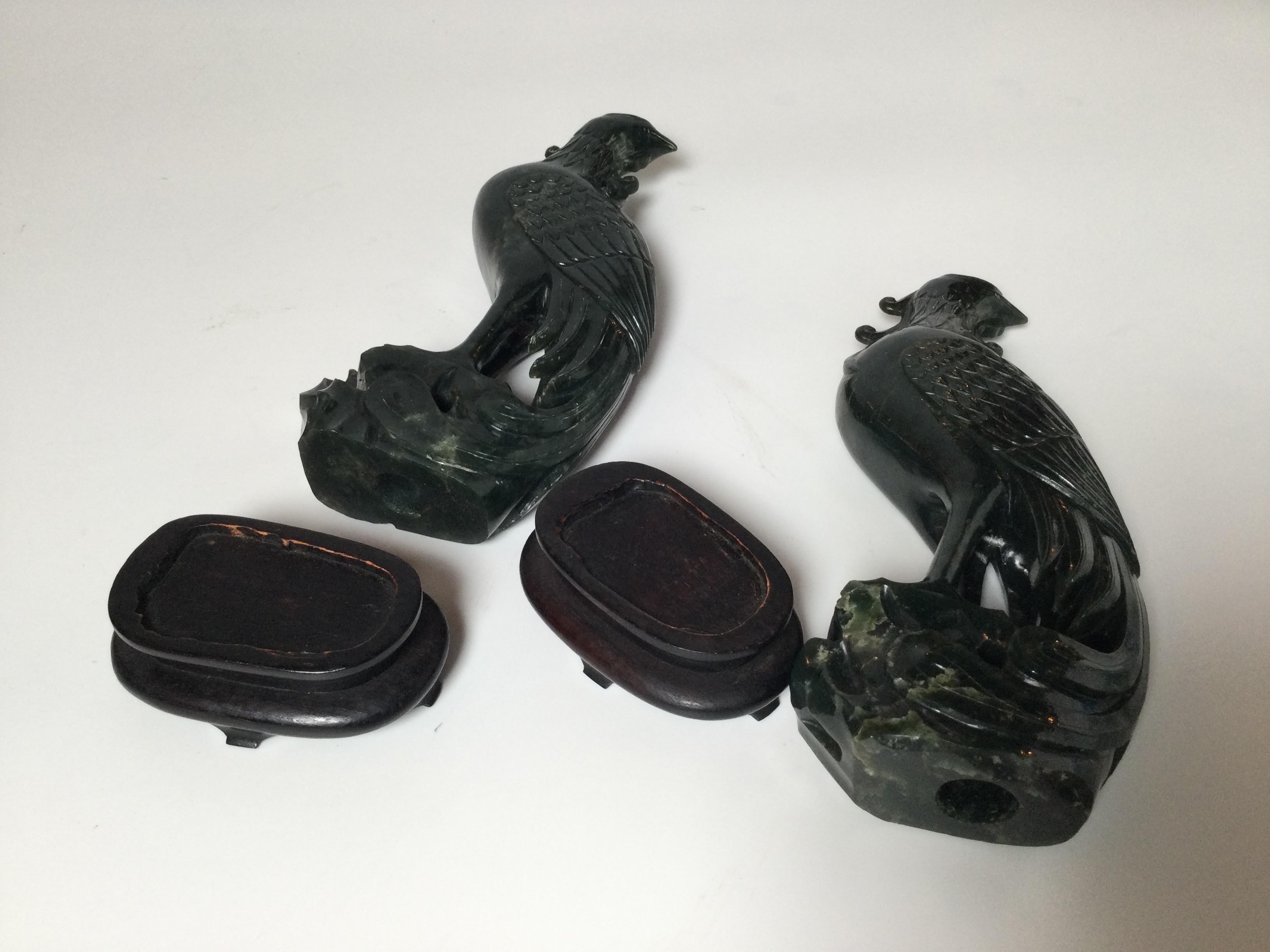 Early 20th Century Pair of Hand Carved Spinach Jade Phoenix Bird Figures with Wood Stands For Sale