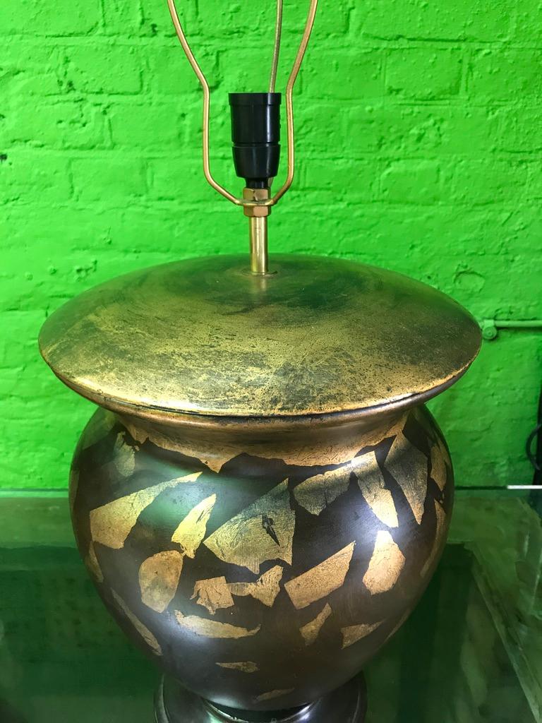 A Pair of hand-painted wooden table lamps. Gold-gilt and lacquered paint on a turned wooden carved jar. These would look wonderful styled with a traditional pleated shade.