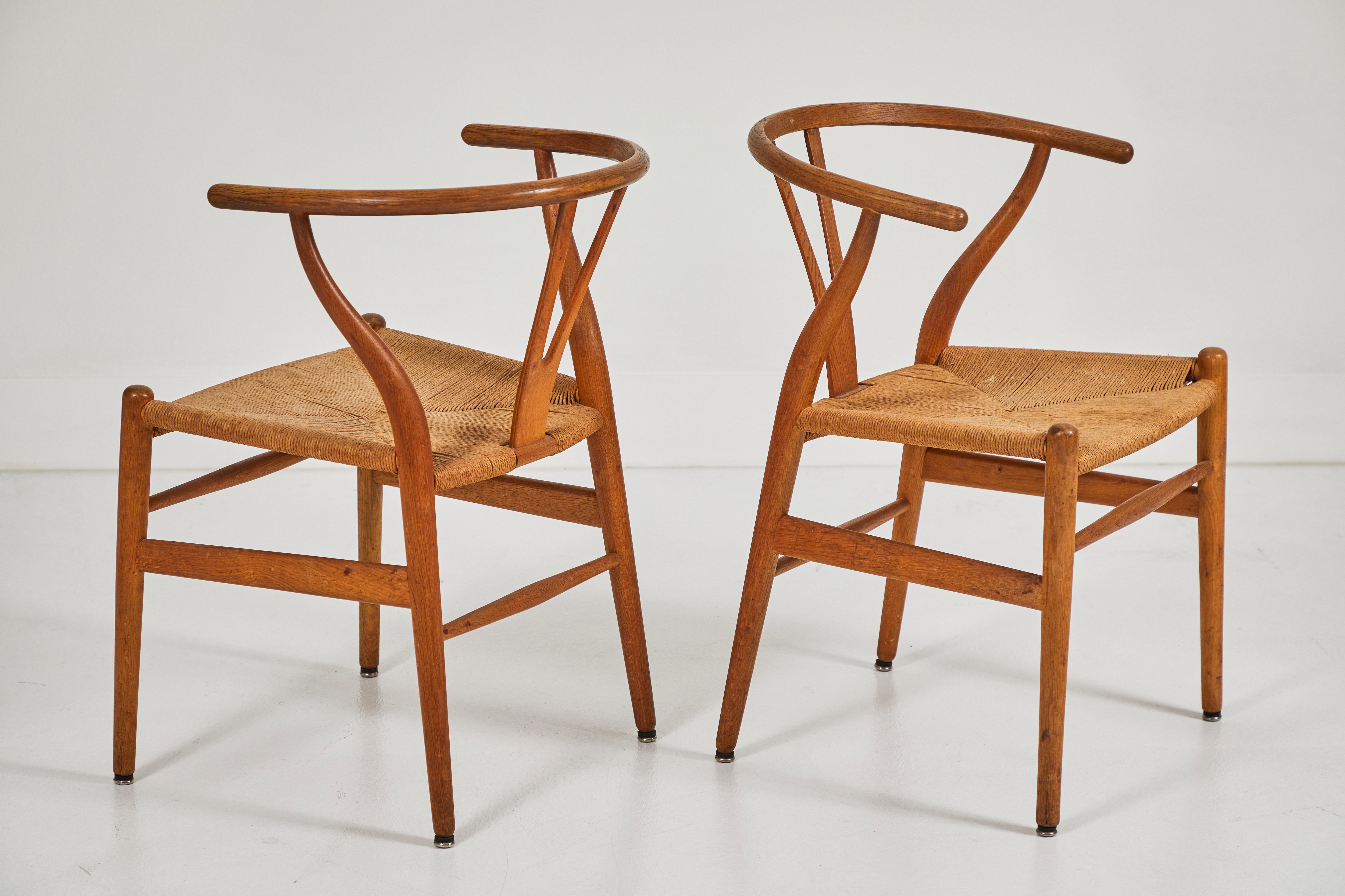 Named after the wishbone shaped back rest, these chairs attributed to Hans Wegner exemplify mid-century danish modern furniture. The simplicity combined with functionality is an excellent example of the aesthetics of Danish furniture. The arms are