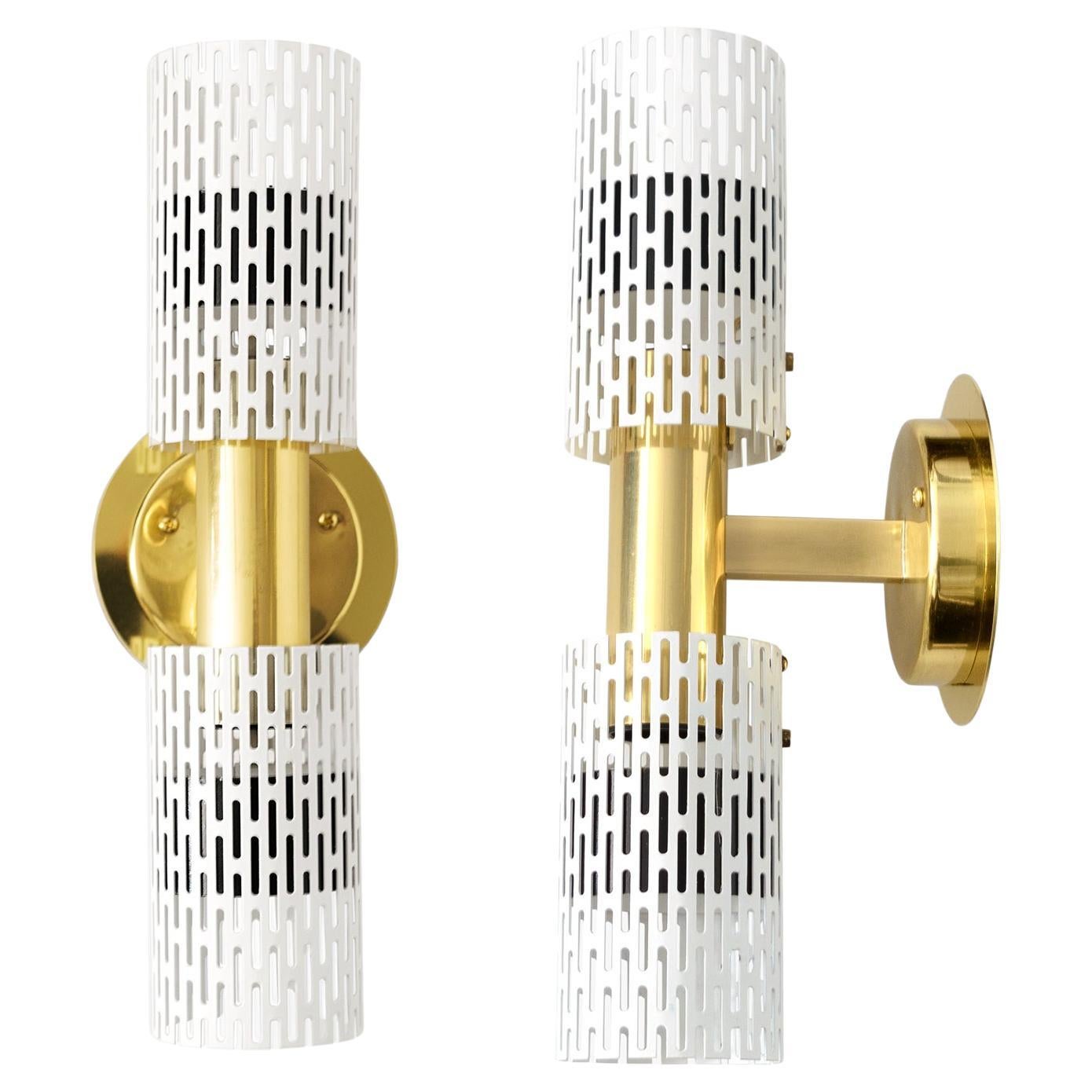 A pair of Harald Notini designed wall sconces with pieced tubular painted metal