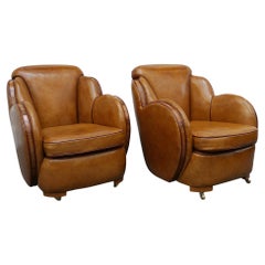 A Pair of Harry & Lou Epstein Brown Leather and Walnut Art Deco Cloud Armchairs