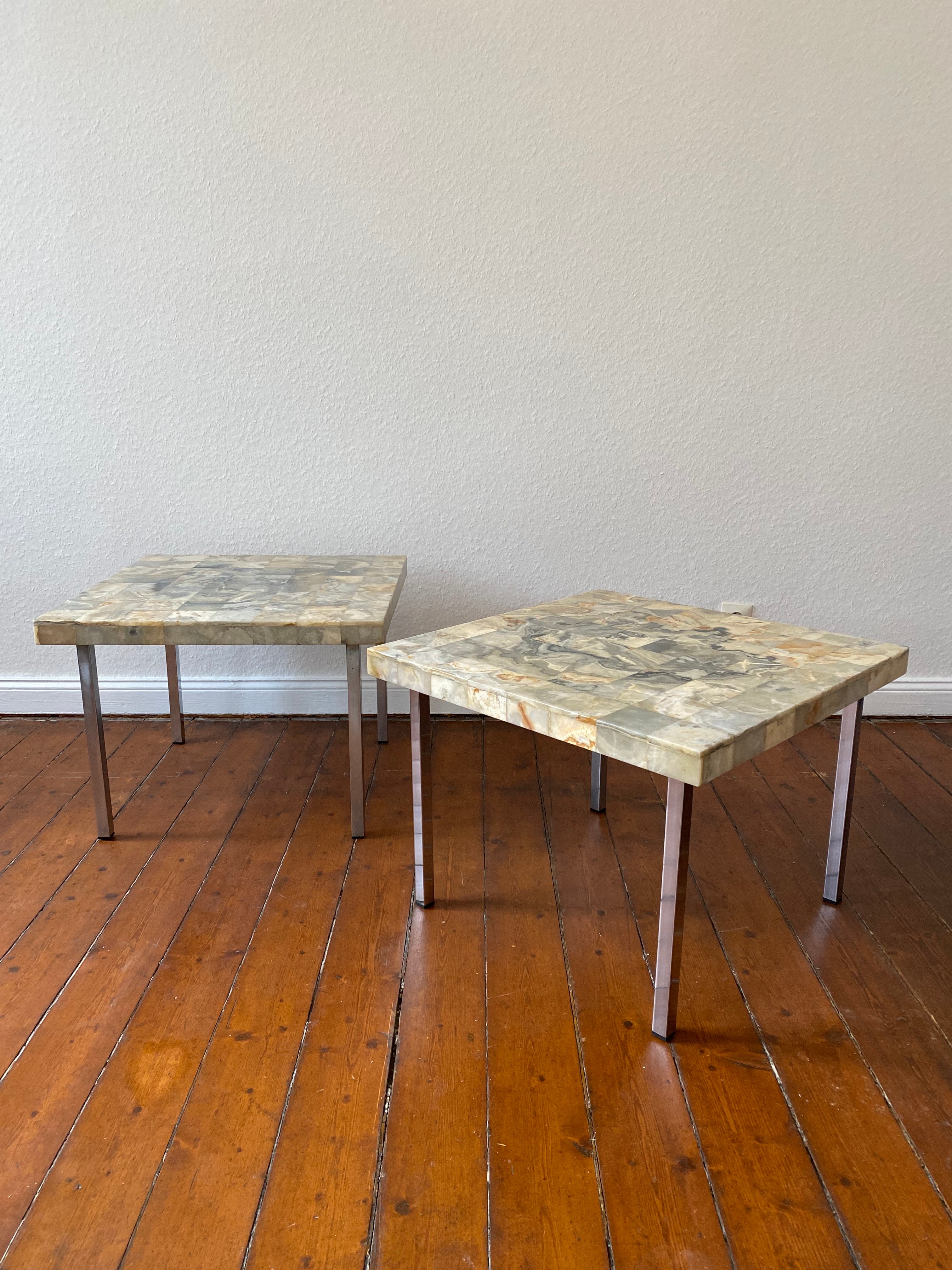 A Set of two rare coffee or End Tables , Model :Kalkutta(Calcutta) by German Sculptor Heinz Lilienthal, 1927-2006.
The design of 64 square mosaic marble pattern combined to one tabletop is exemplary for the fine handcrafted work of this Artist.
The