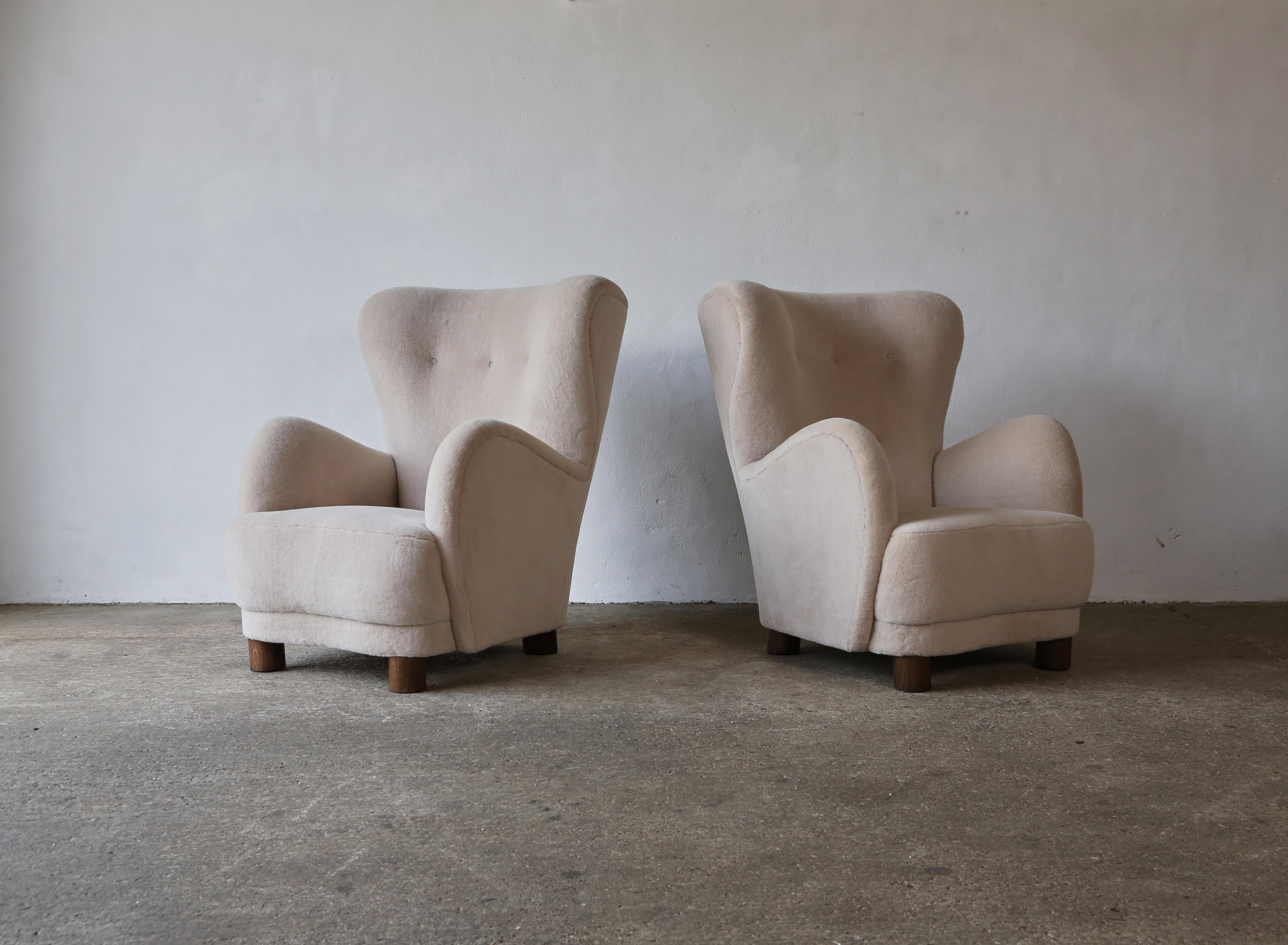 A super pair of modern 1940s style high backed armchairs.  Handmade beech frames, sprung seat and solid oak feet.   Newly upholstered in a luxurious, soft, pure alpaca wool fabric.  Priced and sold as a pair together.    Fast shipping worldwide.


