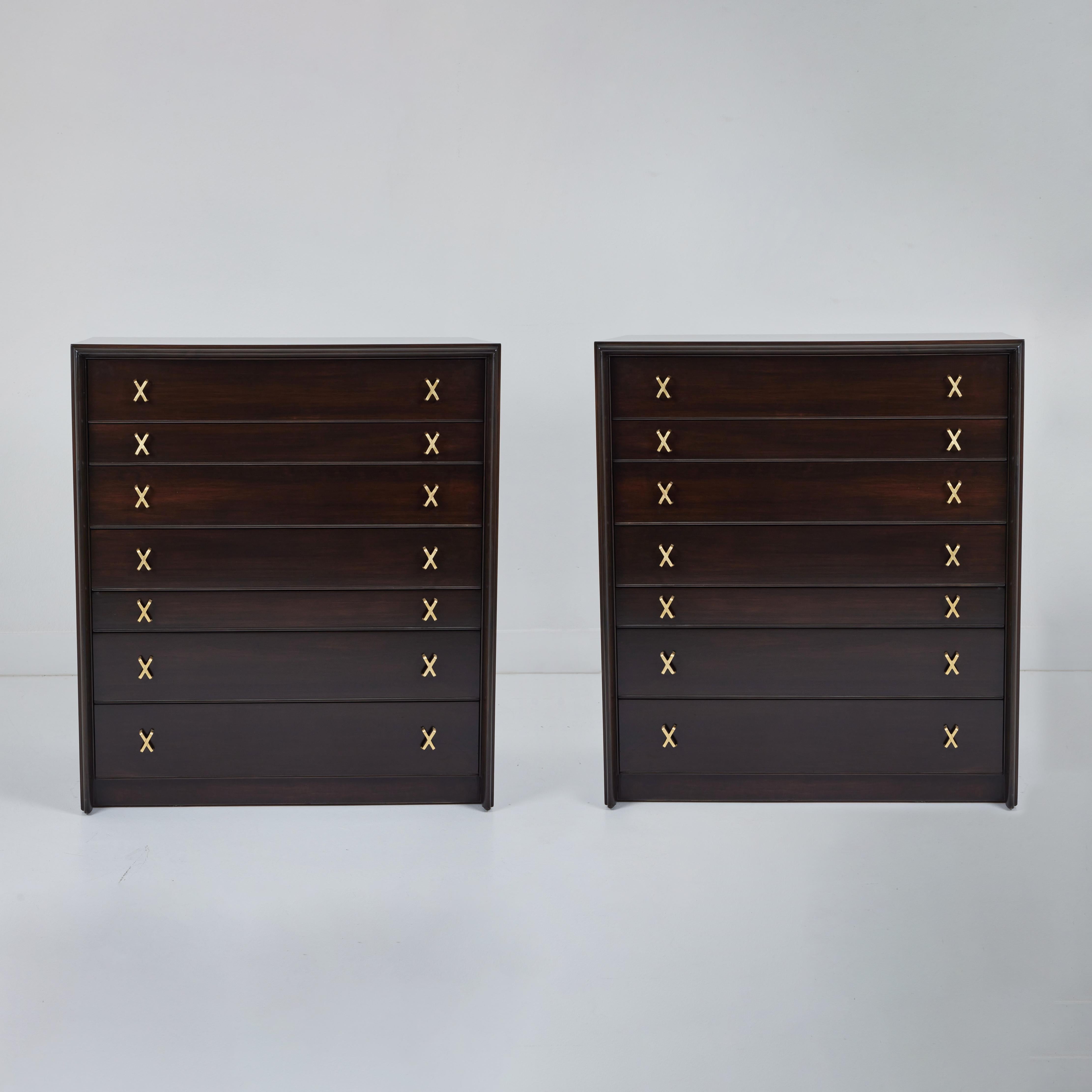This pair of high chests  designed by Paul Frankl for Johnson Furniture were produced in the 1950s. Standing the test of time, the craftsmanship of these is unmistakable. The chests have been restored sporting a dark stain, allowing for subtle hints
