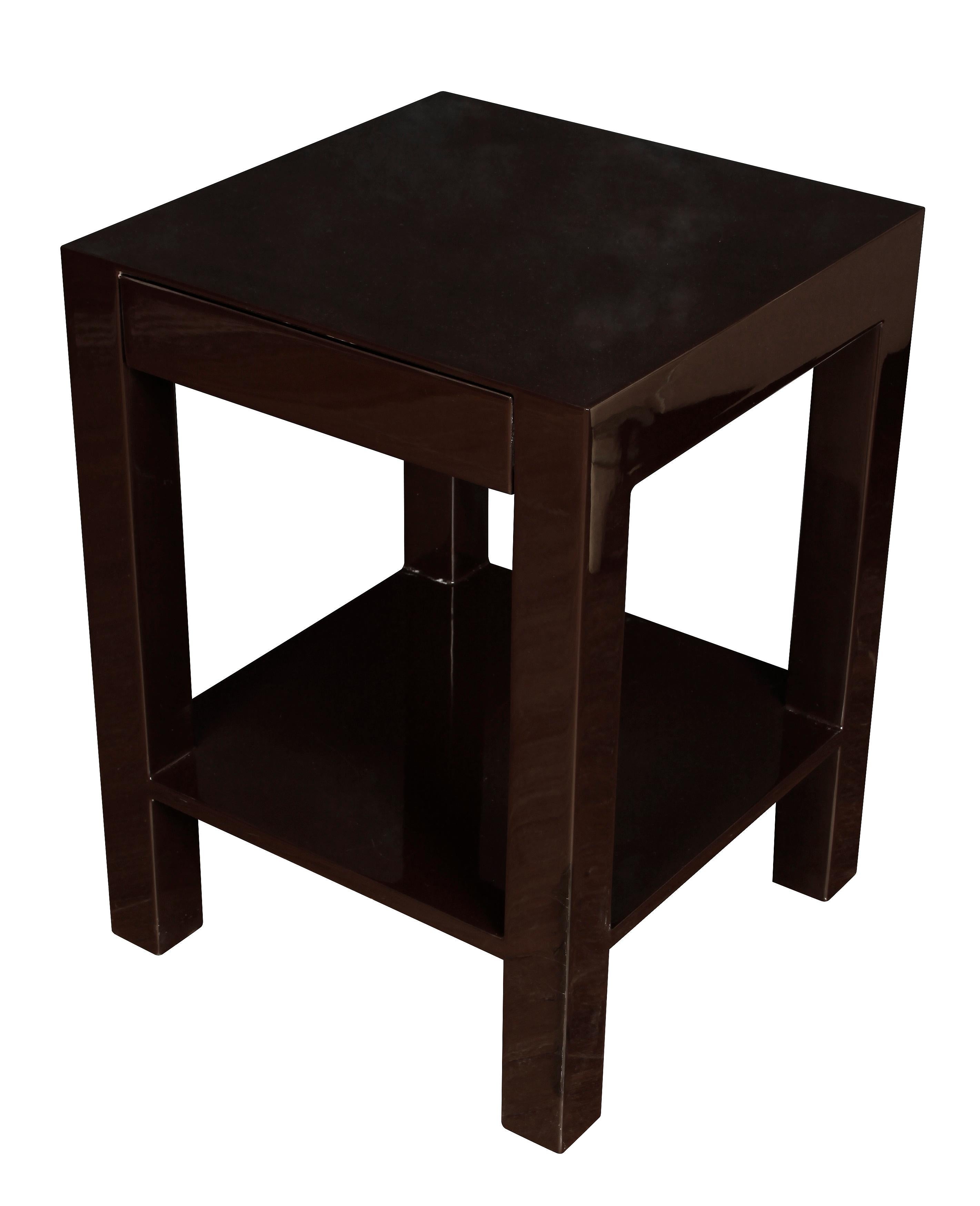 A pair of high gloss brown lacquer side tables in modern parsons style with a low shelf.