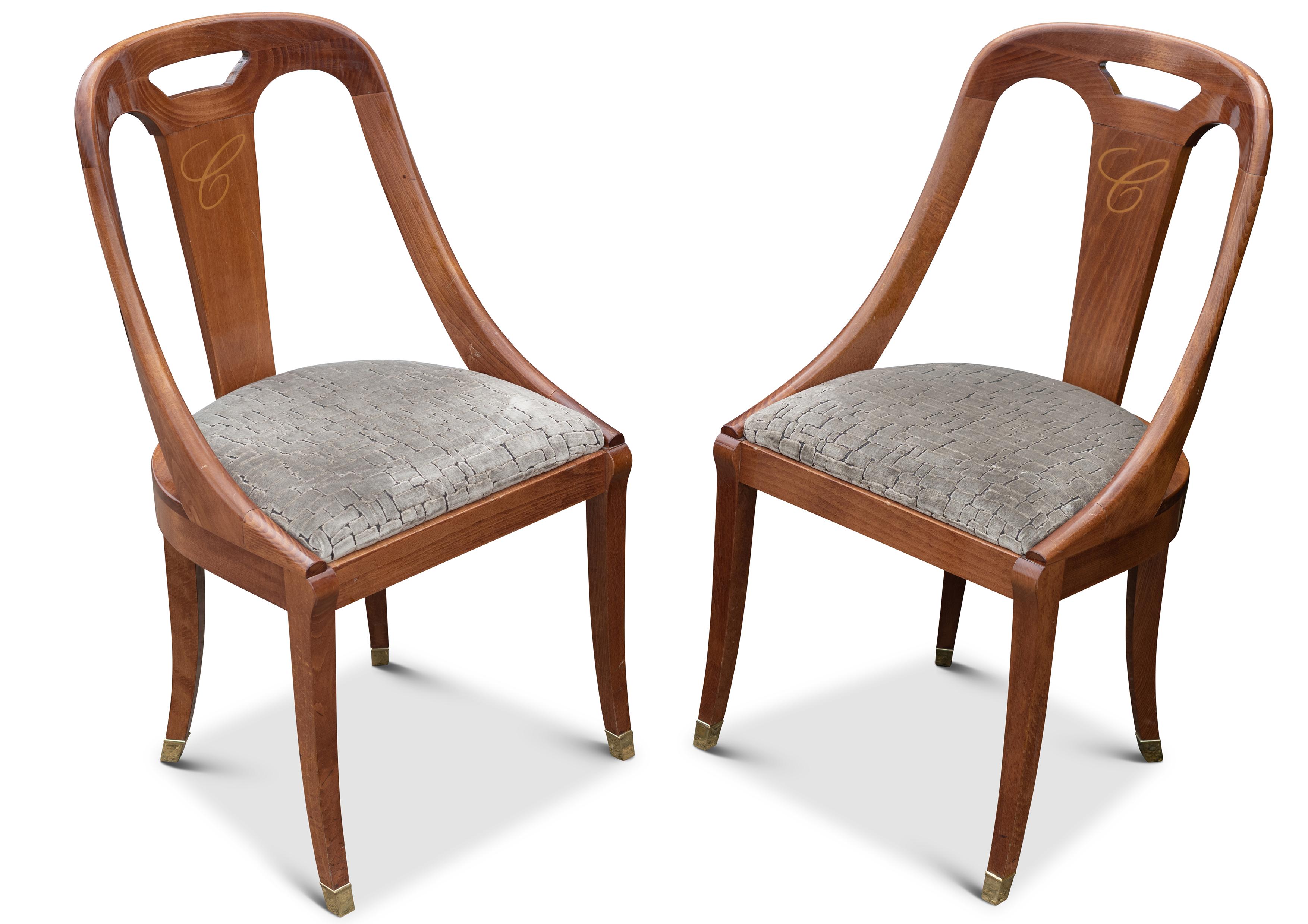 A Pair of Hollywood Regency Beech Curved Back Hallway Chairs With Upholstered Seats & Brass Leg Cups 

Very Well Executed Chairs, with beautiful wood grain.


