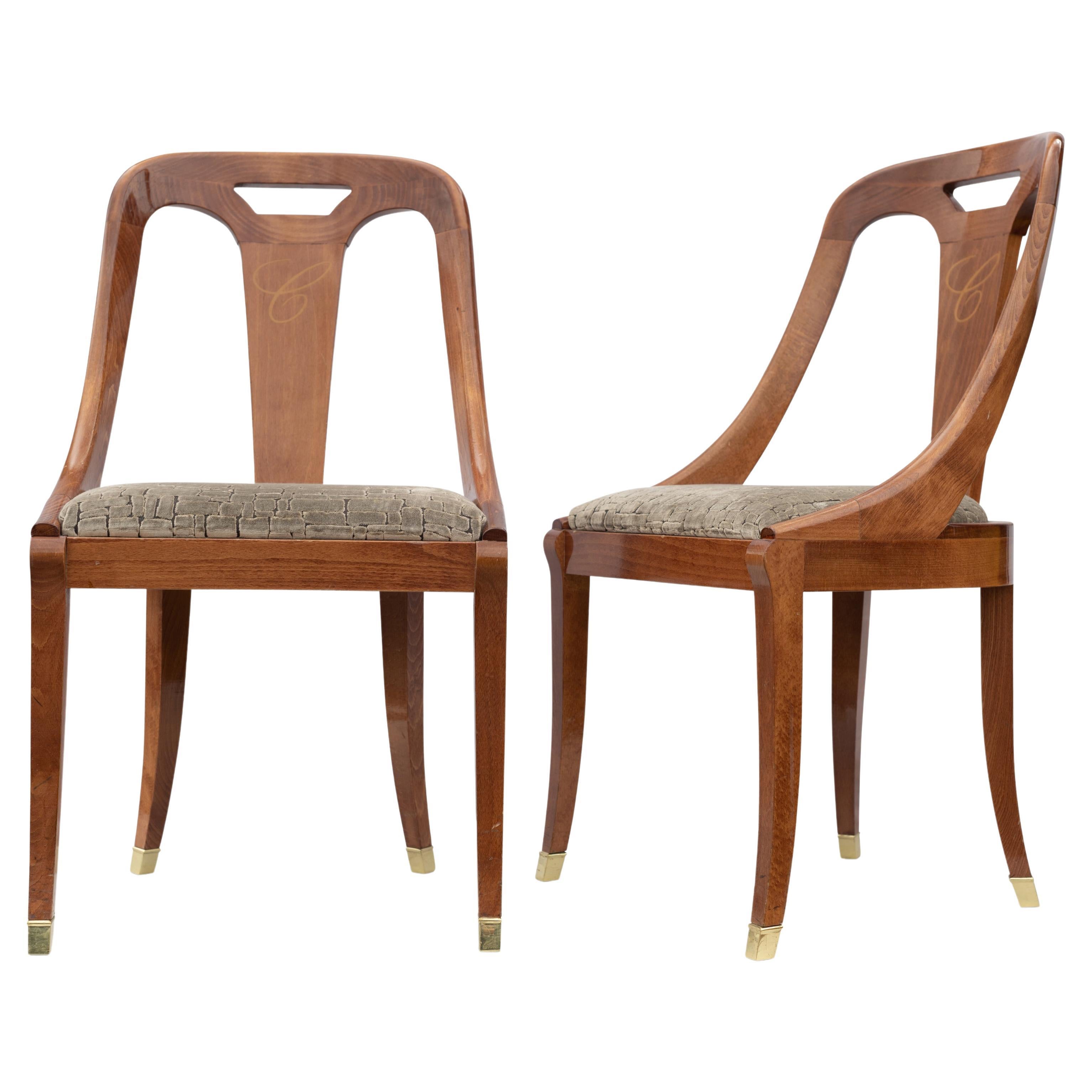 Paire de chaises de salle à manger de style Emile-Jacques Ruhlmann à dossier incurvé en hêtre