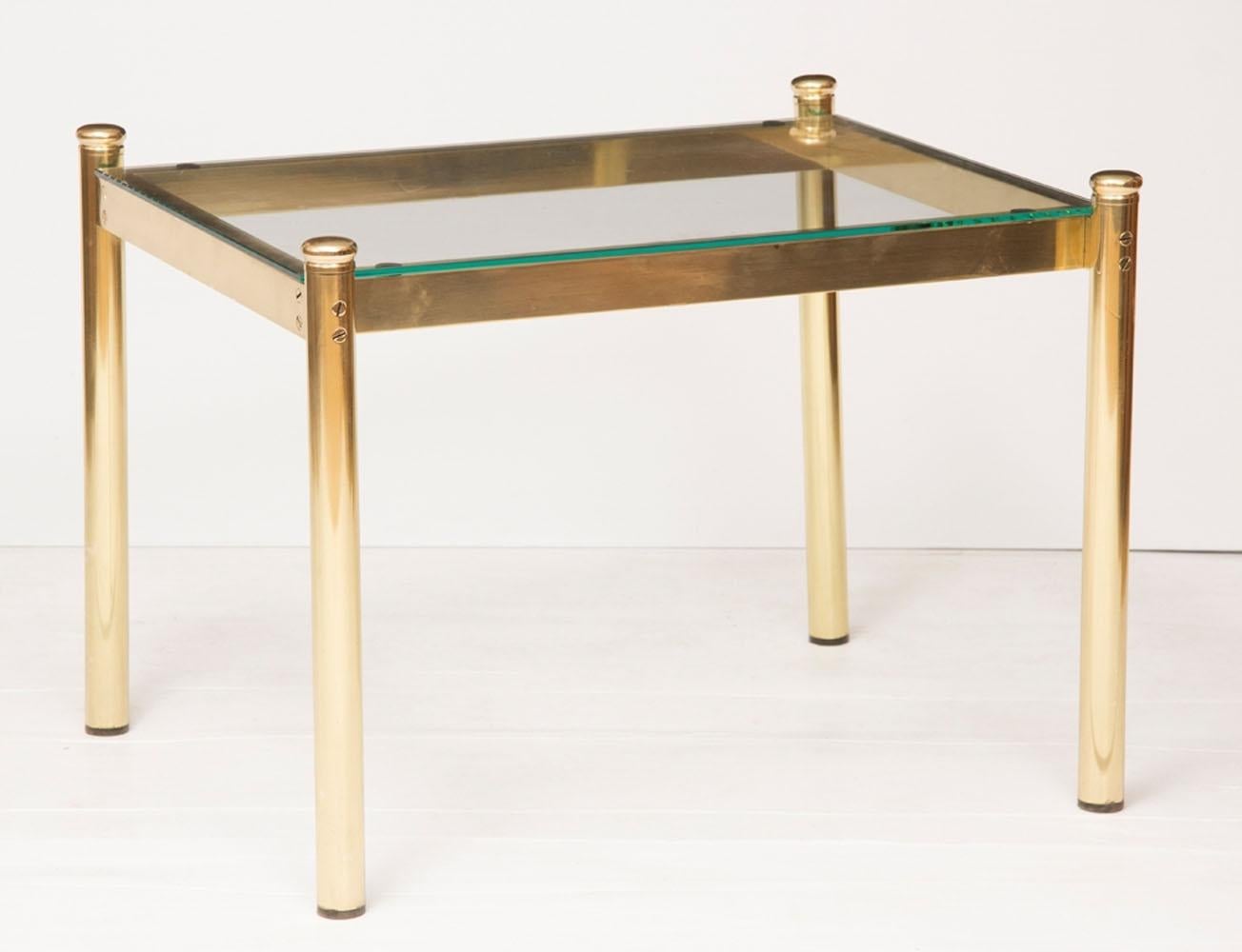 A pair of Hollywood Regency brass and glass coffee table.

These are in very good condition because they have been polished and sealed.