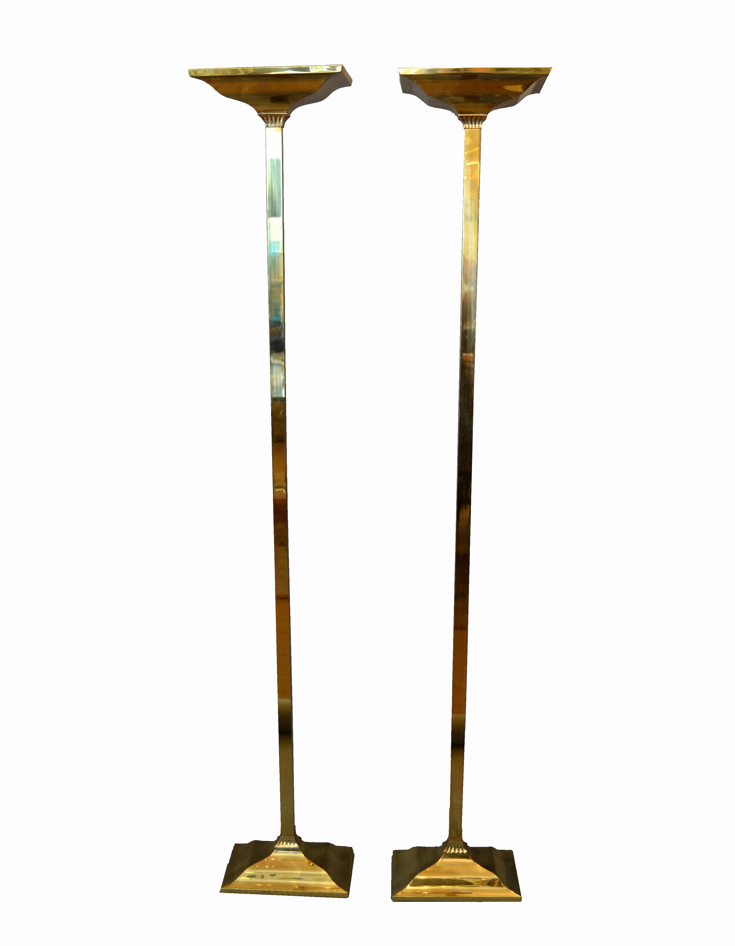 A pair of Hollywood Regency brass torchiere floor lamps.
Both are in perfect working condition and each comes with an Halogen Light.
The brass has been recently polished.
