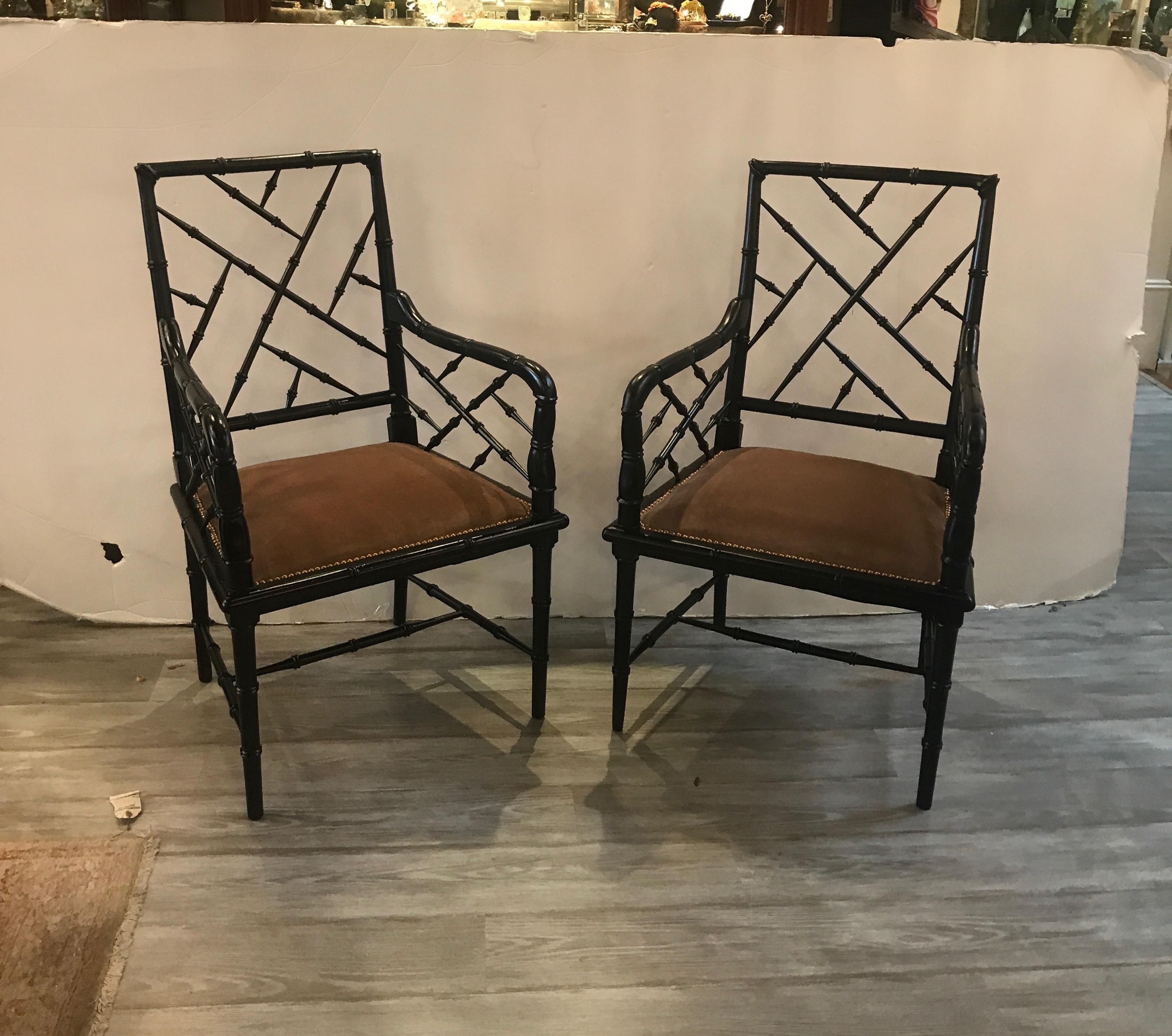 A great pair of Hollywood Regency armchairs with upholstered seats. The hardwood frames carve in a faux bamboo lattice pattern with new mink colored velvet attached seats. Beautifully made, of the James Mont style and era.