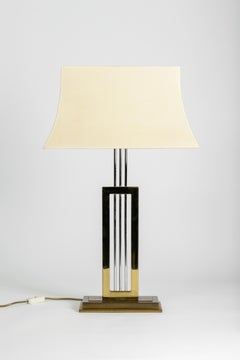 a pair of Hollywood Regency table lamps in brass and chrome