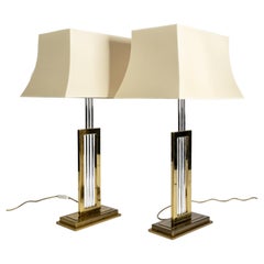 a pair of Hollywood Regency table lamps in brass and chrome