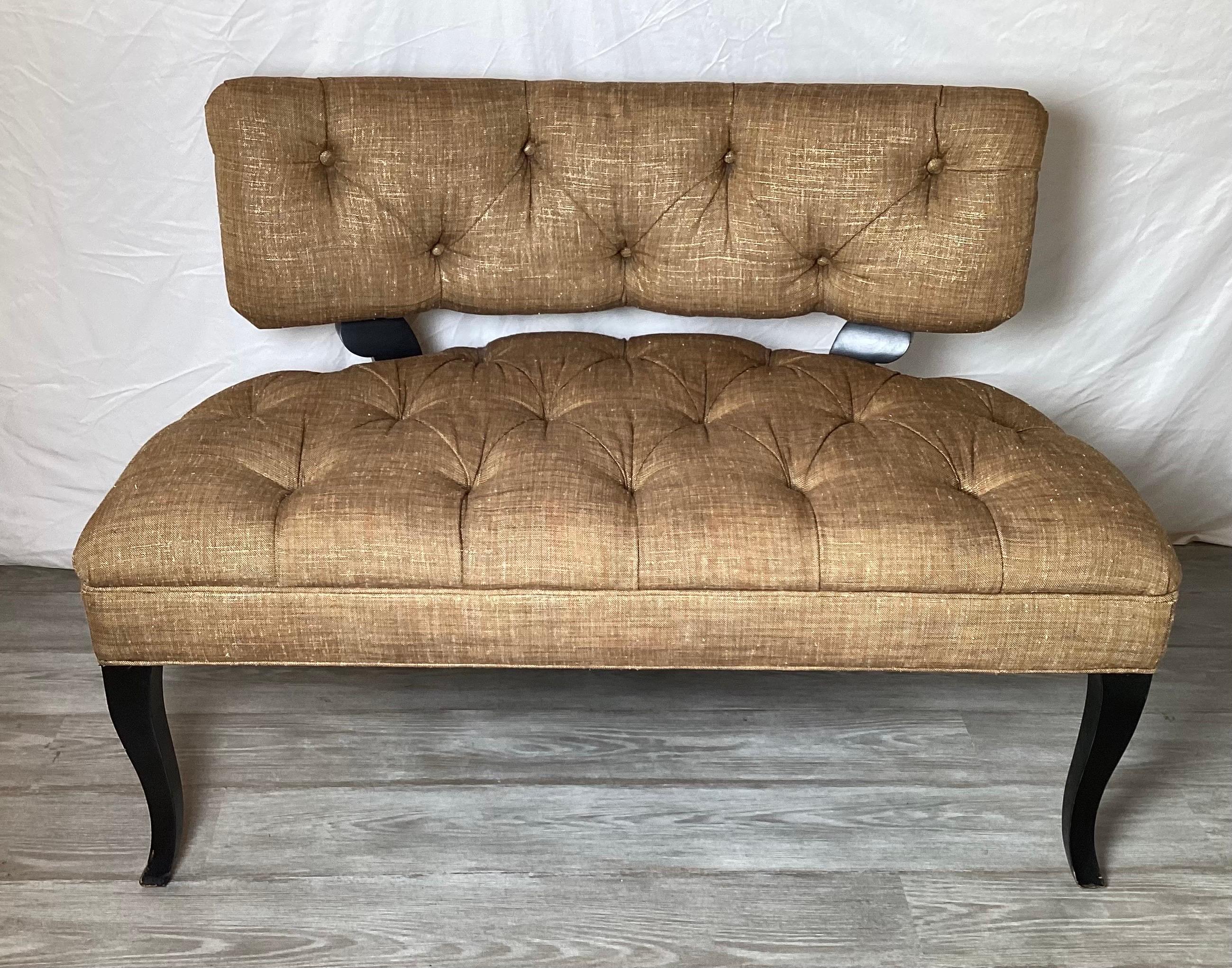 An elegant pair of Hollywood Regency style settees with tufted back and sheet. The linen blend woven fabric with ebonized wood legs. These settees are high style an light in scale. Measures: 45 inches long, with a lower profile 31 inch back.