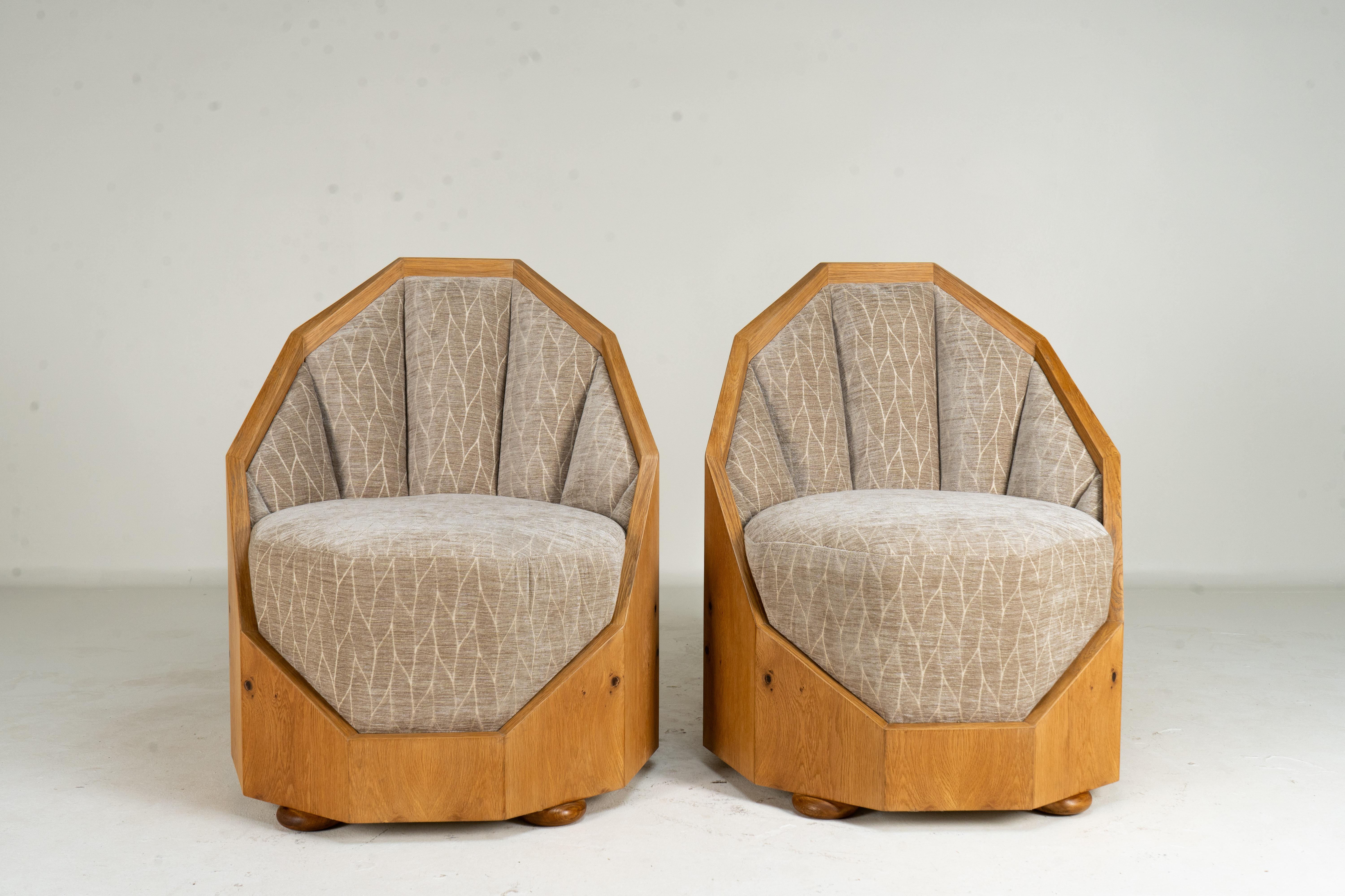 This pair of contemporary Hungarian cocoon chairs exemplifies casual modern elegance but is actually based on a Hungarian Art Deco original design from the 1930's. Each chair features a distinctive octagonal structure, crafted with precision and