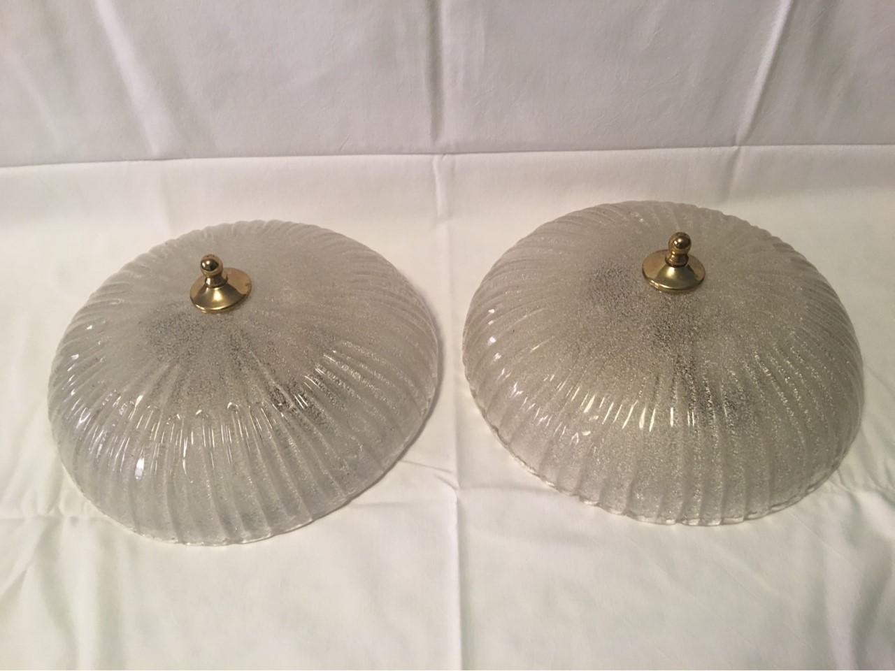A lovely, great looking pair of ice glass flush mounts or sconces with brass brackets by Honsel of Germany. Manufactured in the 1970s. Rewired for US standards.
Require 2 European E 26 / 27 Edison Bulbs for each fixture with a maximum of 40 watts