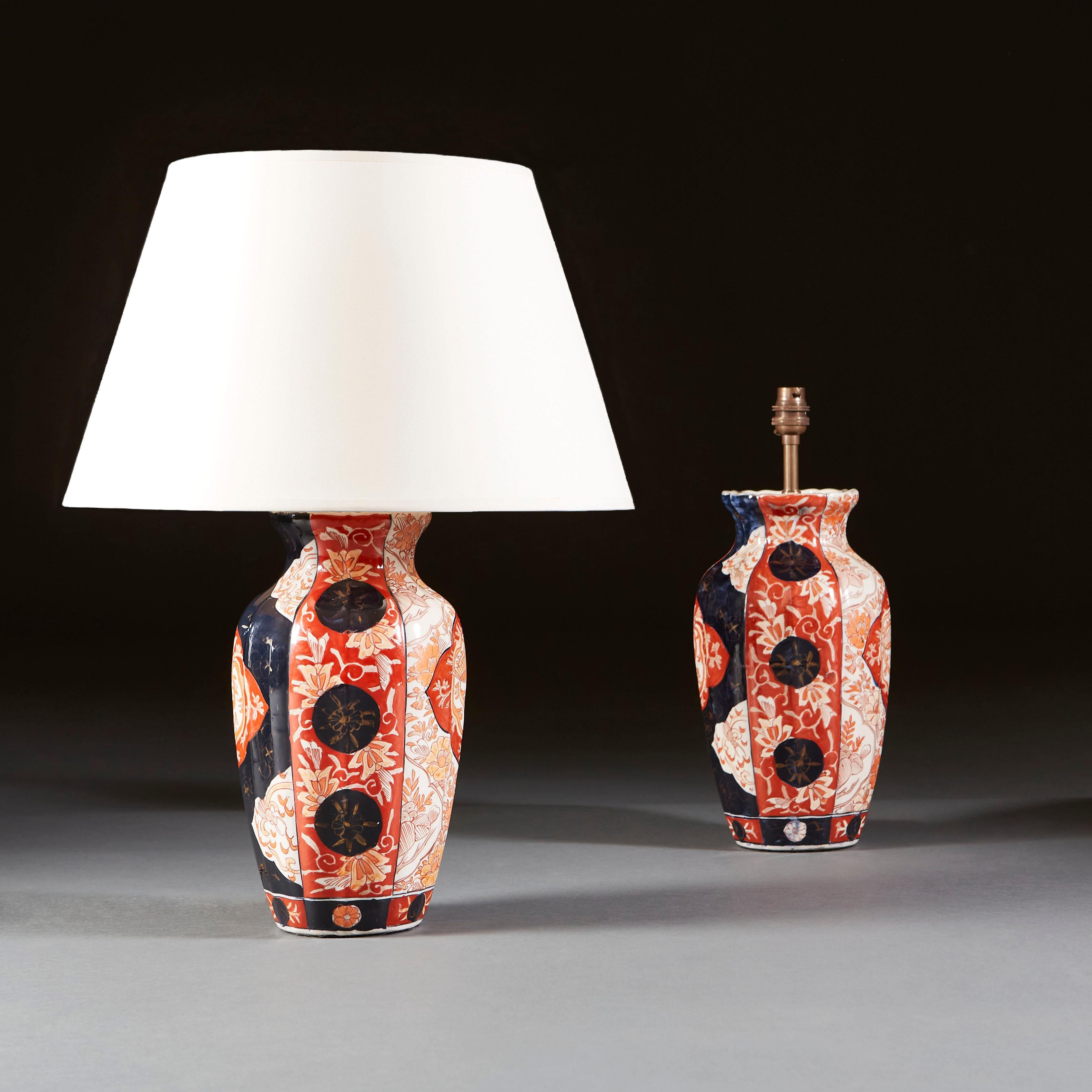 A late nineteenth century pair of Imari vases, with blue and red floral decorations and blue medallions and red diamonds to each side, now as a lamp.

Currently wired for the UK. 

Please note: lampshades not included.