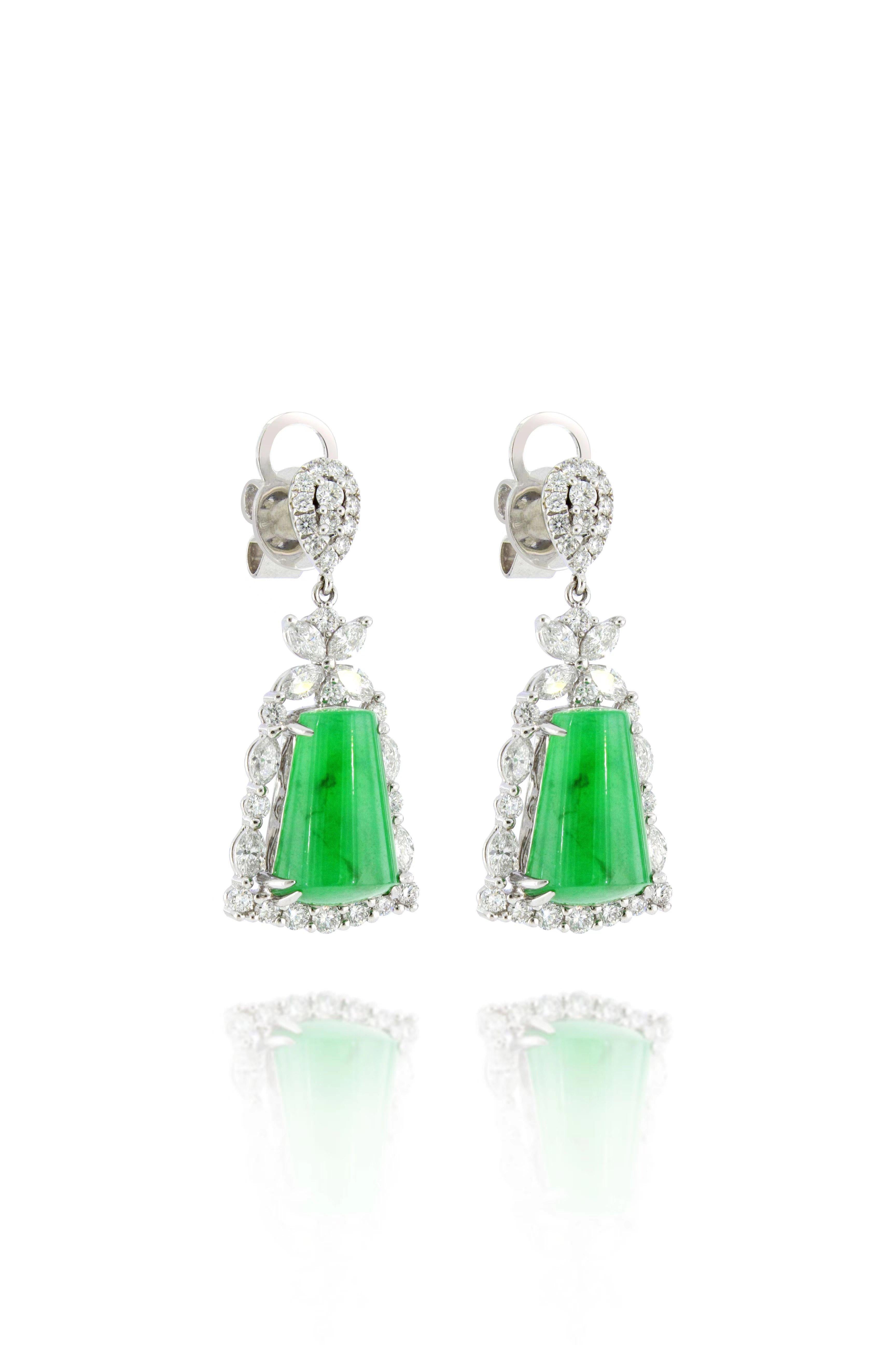 A pair of very fine jadeite and diamond earrings of exceptional translucency, each suspending a natural jadeite jade of brilliant emerald green colour with natural diamonds weighing 1.49 carats, mounted in 18 Karat white gold.  
The company was