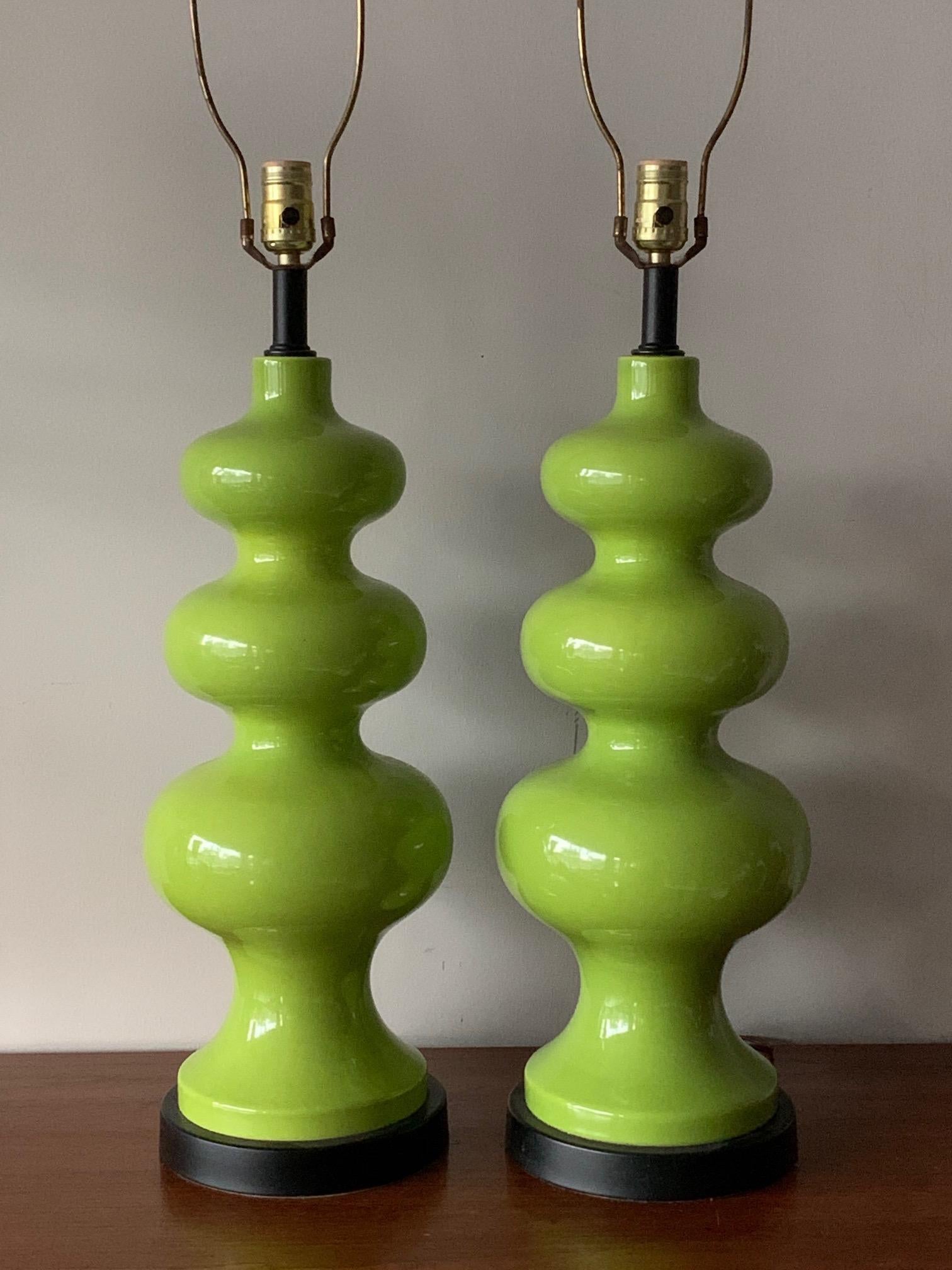 A pair of 1970s sculptural lamps-amazing mint green color, all original with matching green shades.
These are tall and very impressive-a rare find! Total height with shades 41.5