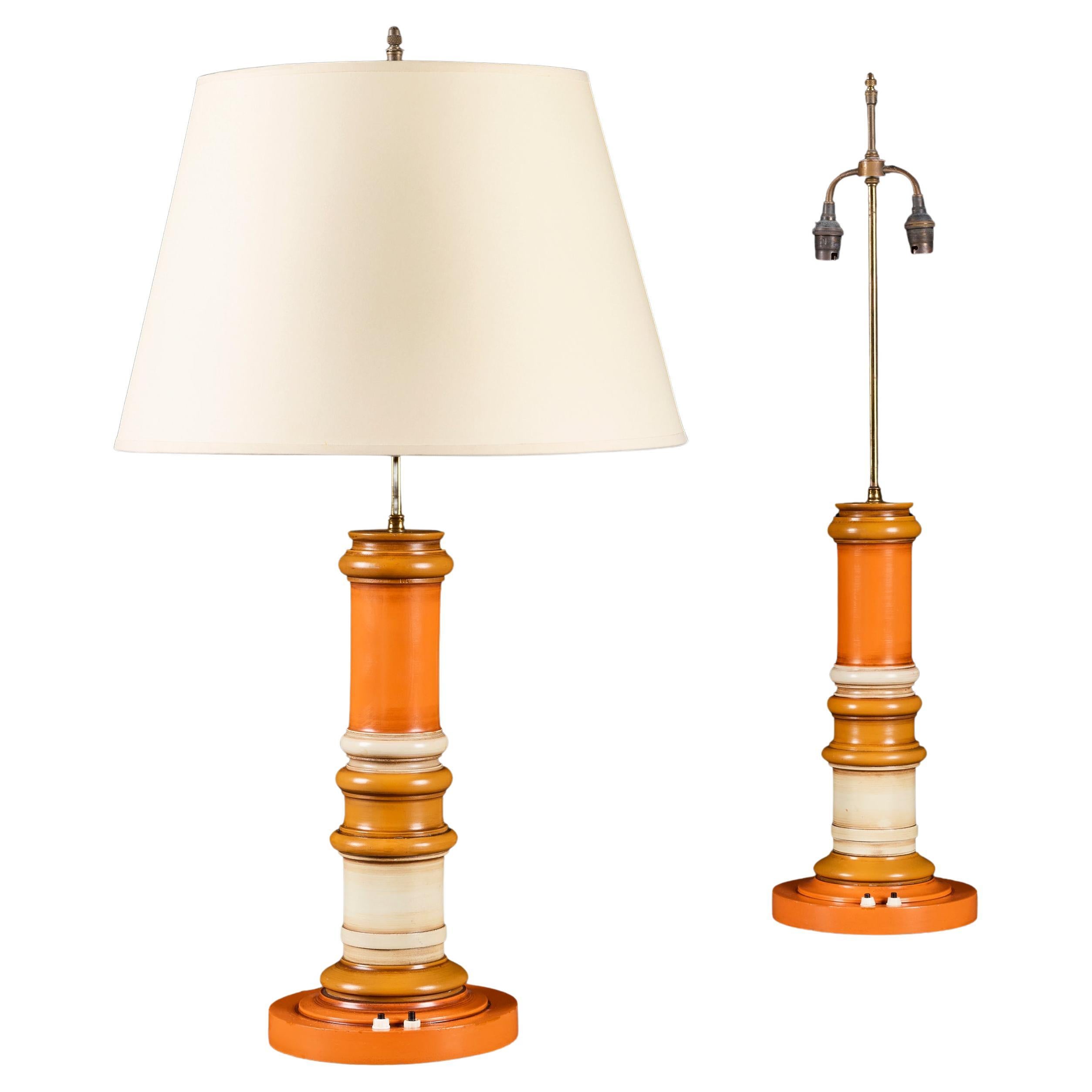 A Pair of Indian 20th Century Orange Painted Column Lamps For Sale