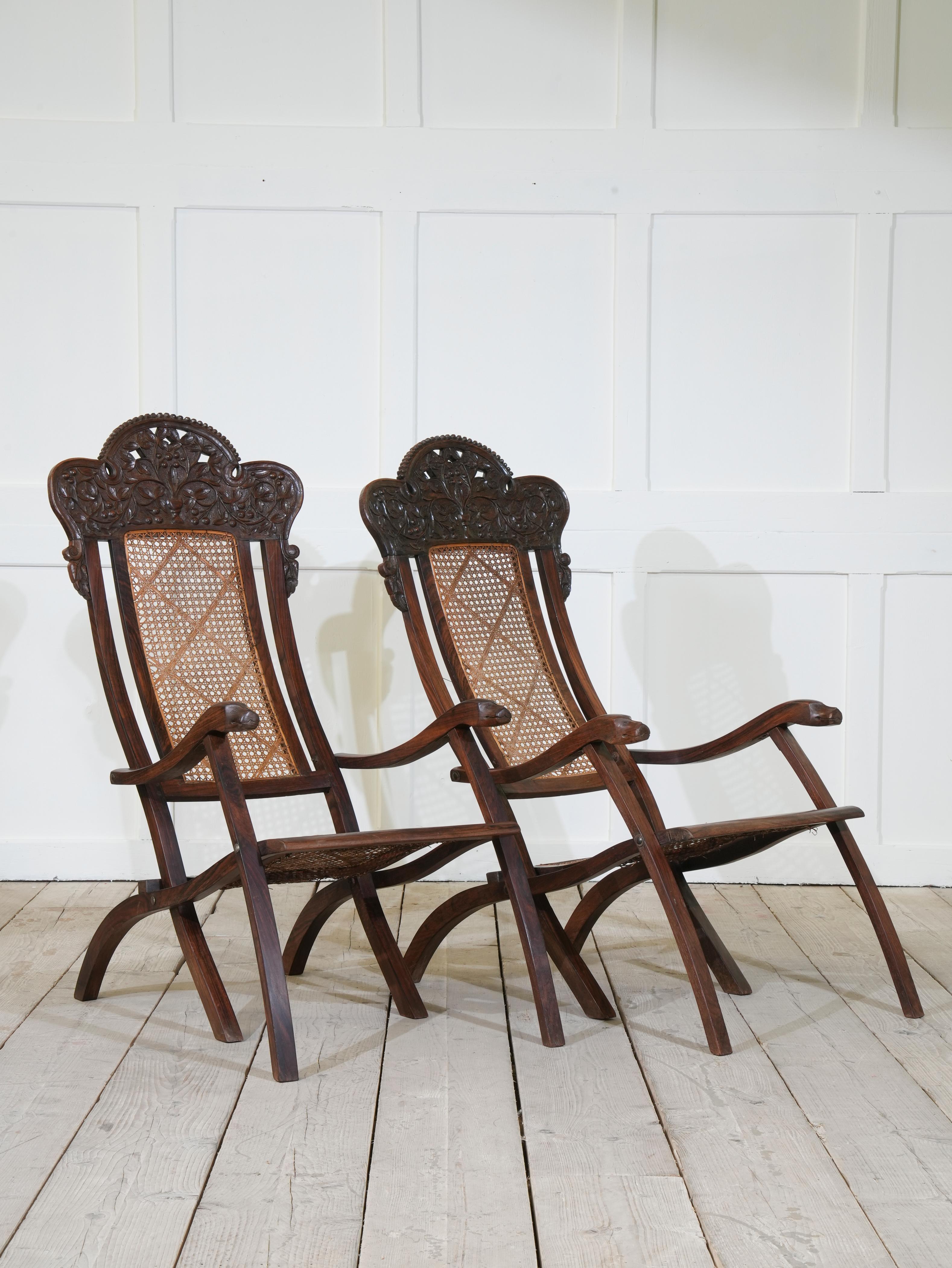 Carved Pair of Indian Caned Mahogany Folding Conservatory Chairs