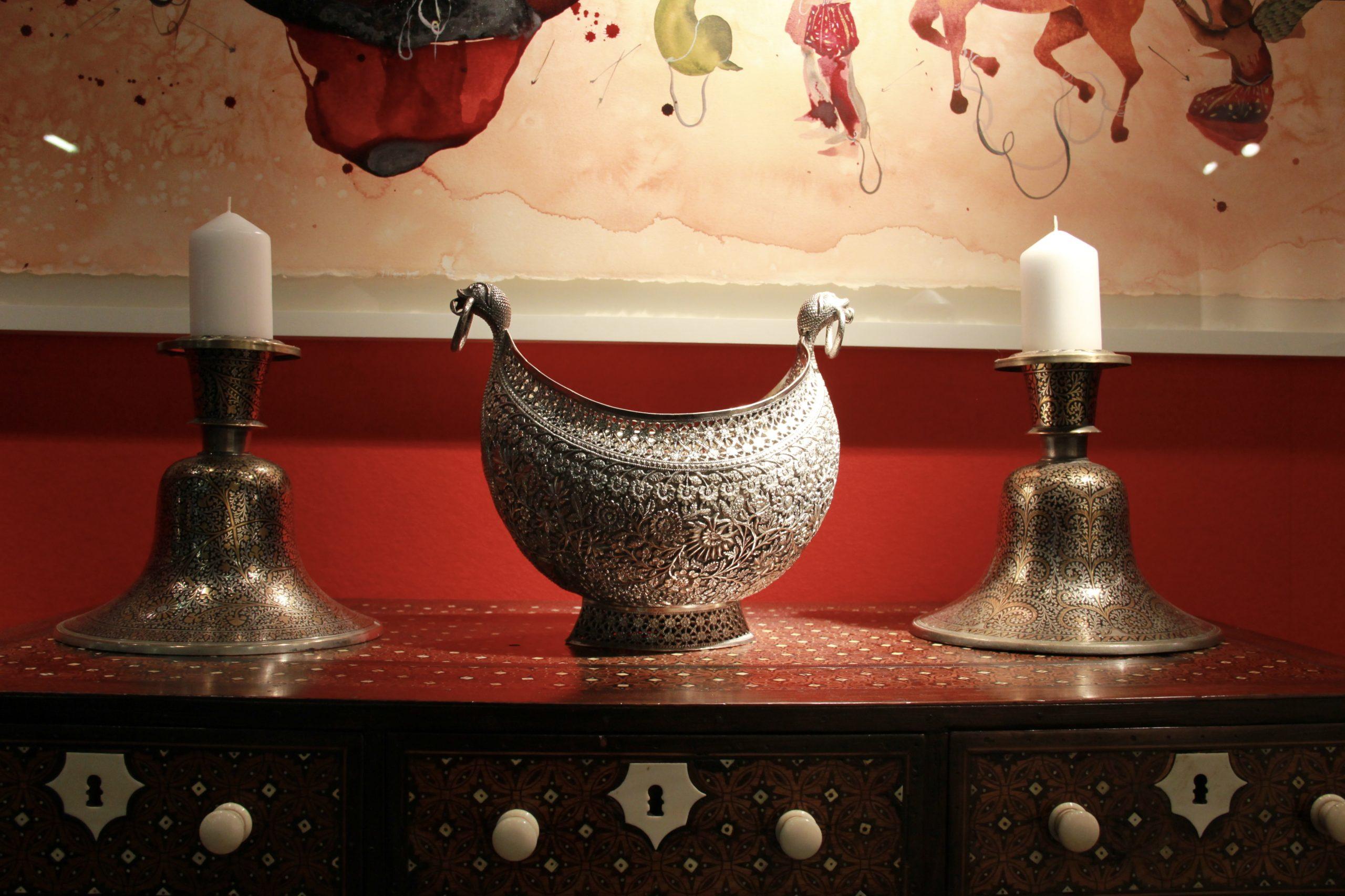 20th Century A pair of Indian Mughal silver and brass inlaid candlesticks For Sale