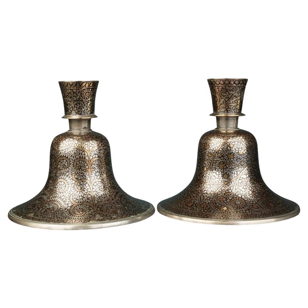 A pair of Indian Mughal silver and brass inlaid candlesticks For Sale