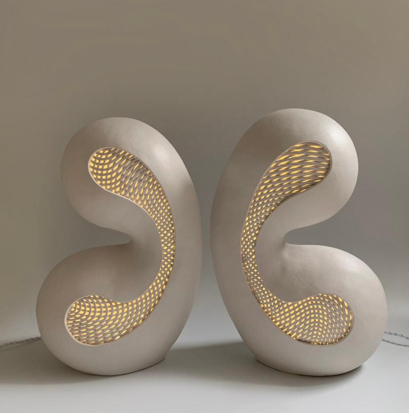 A Pair of Internally Lighted Ceramic Sculptures Titled 