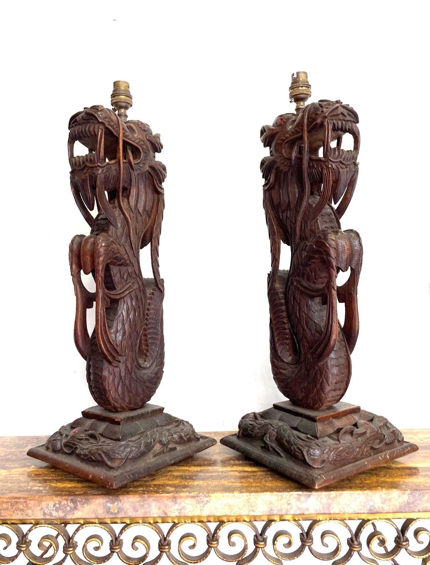 Pair of Intricately Carved Burmese Dragon Lamps Each Mounted on Carved Wooden For Sale 9