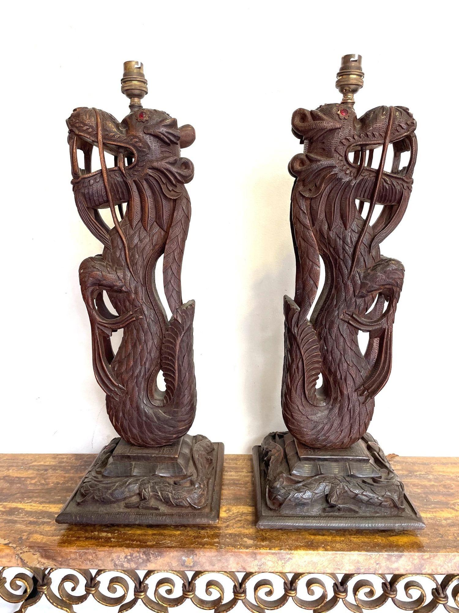 Pair of Intricately Carved Burmese Dragon Lamps Each Mounted on Carved Wooden For Sale 1