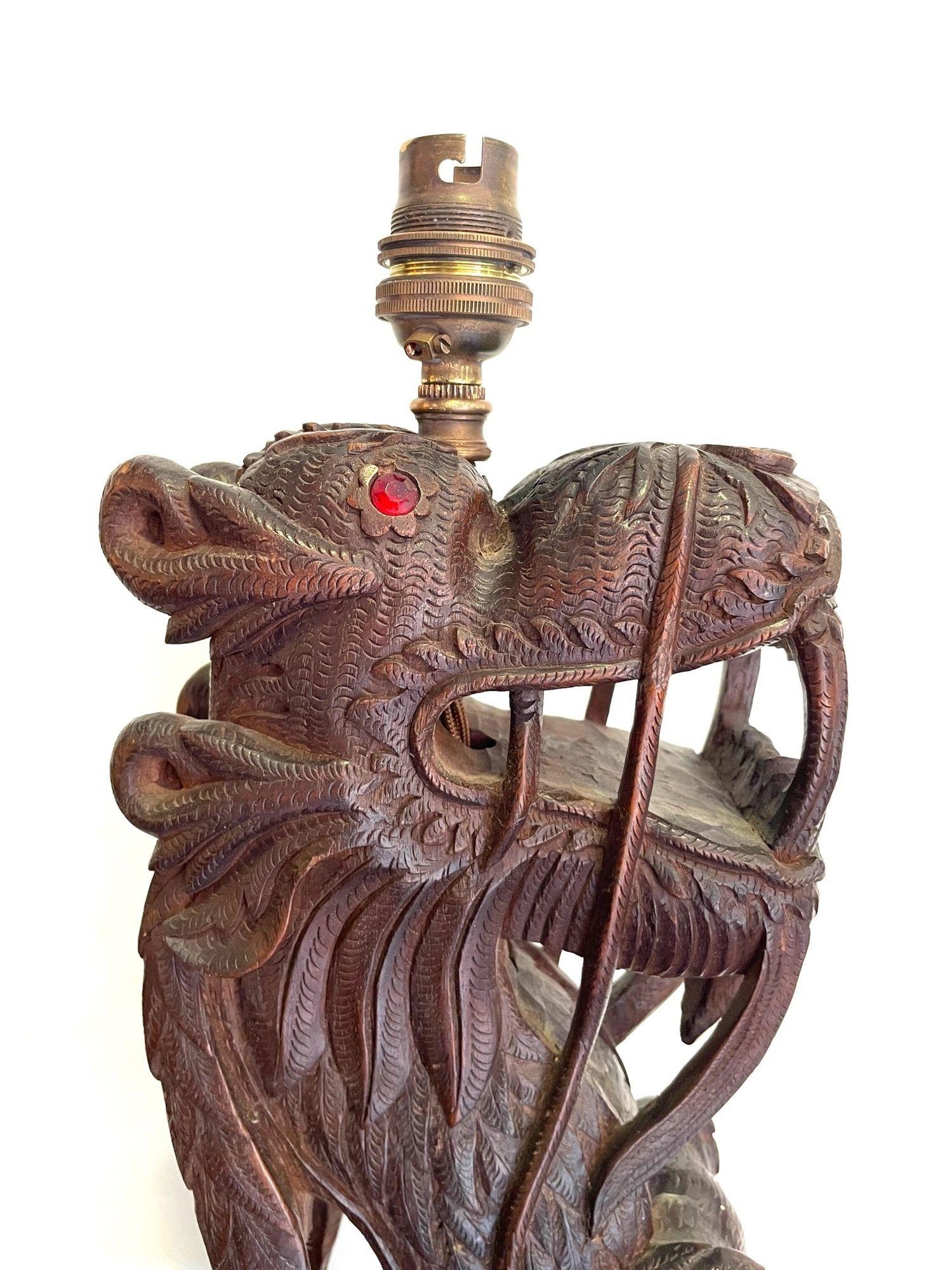 Pair of Intricately Carved Burmese Dragon Lamps Each Mounted on Carved Wooden For Sale 2