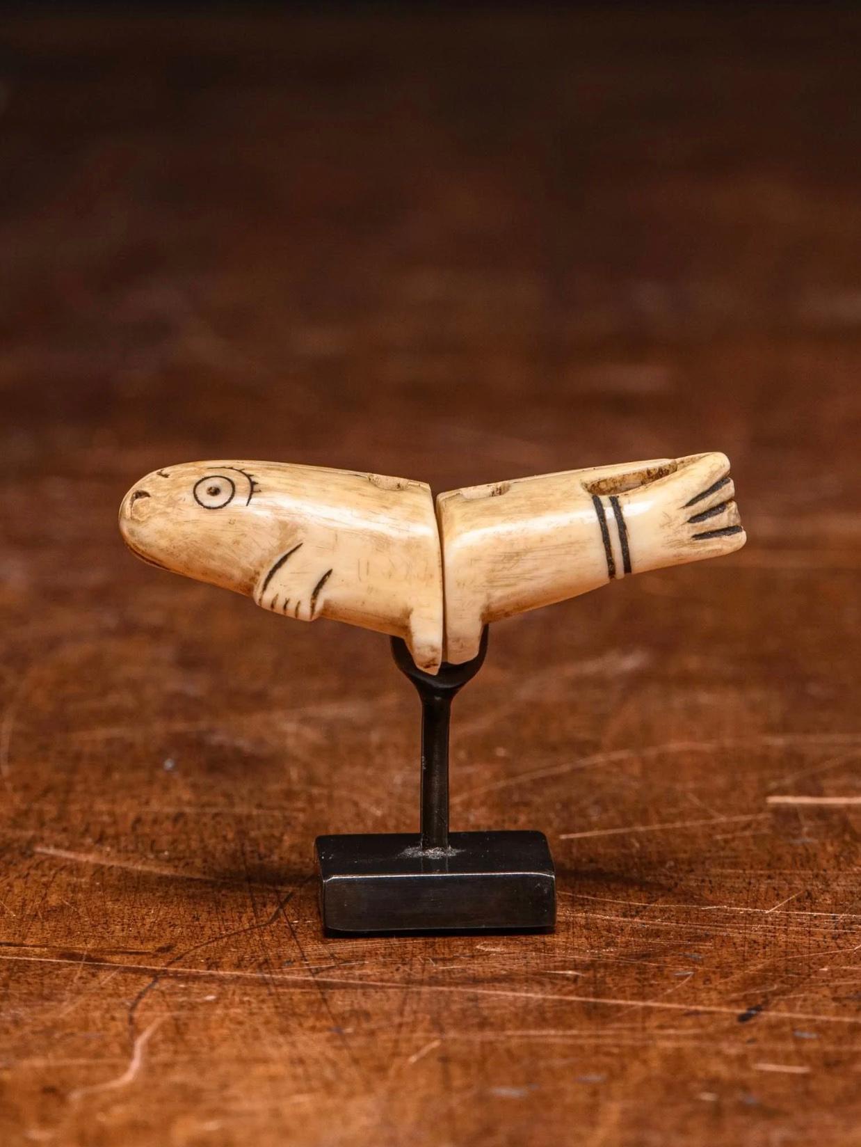 A pair of Inuit Marine Ivory charmes, Inuit People,Alaska

Marine ivory Double Knot Charm,Inuit People,Alaska.
Two piece Charm forming a Whale.
Made to fit stand.

7 x 4.4 x 2.7 cm
2 3/4 x 1 3/4 x 1 in