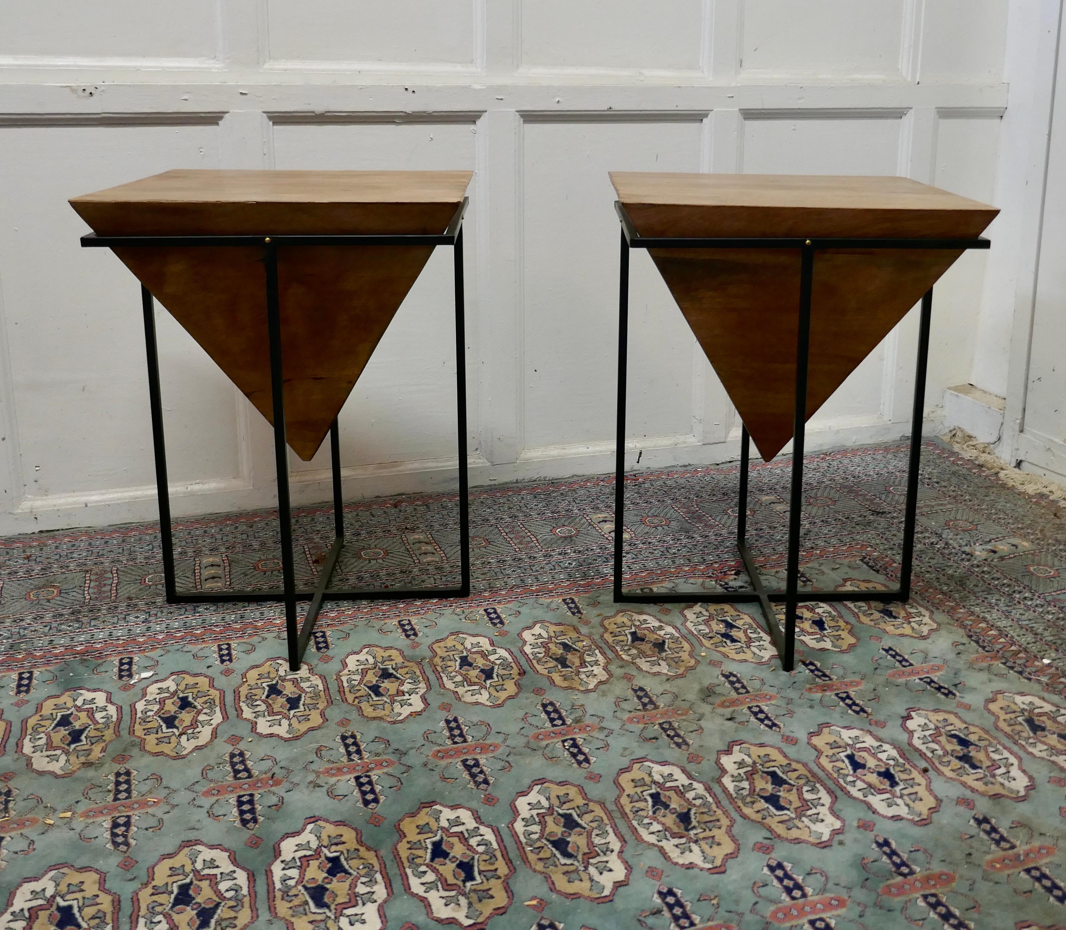 A pair of inverted pyramid occasional tables 

The tables are made from very precisely cut fruit wood in a pyramid shape which is inverted and set in a black steel frame 
These unusual table make excellent Side tables, they are 24” tall and 18”