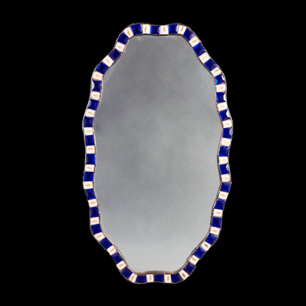 A pair of early twentieth century Irish cut glass mirrors with alternated blue and clear beads to the anamorphic borders.