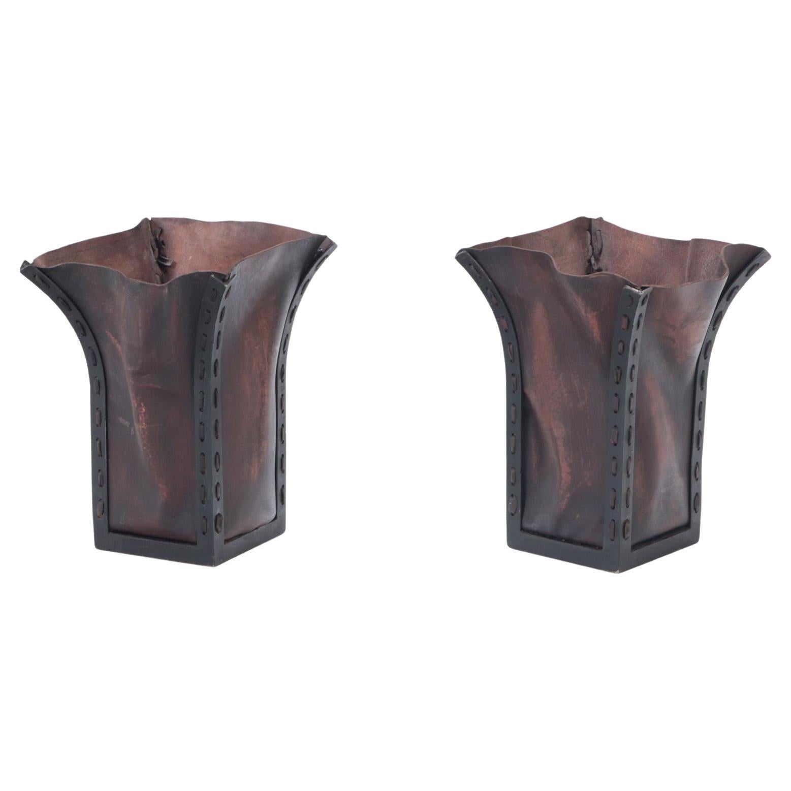 A pair of iron and leather waste baskets, contemporary. For Sale