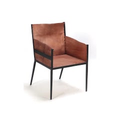 A Pair of Iron and Tailored Leather Armchairs.