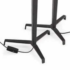 A pair of iron tripod table lamps in the manner of Jean-Michel Frank.