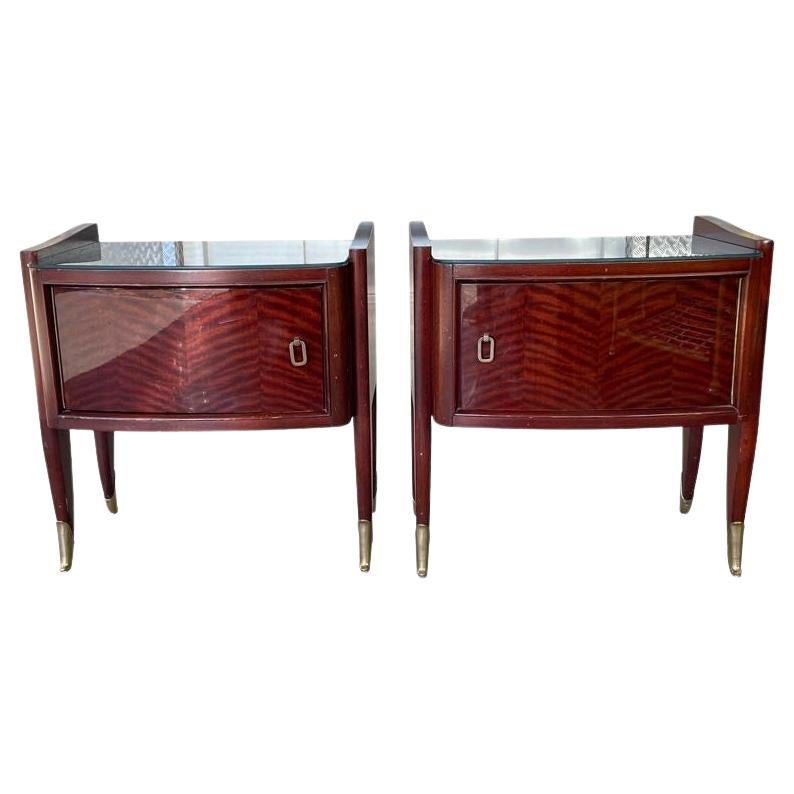 A pair of Italian 1940s mahogany bedside tables with brass detailing For Sale