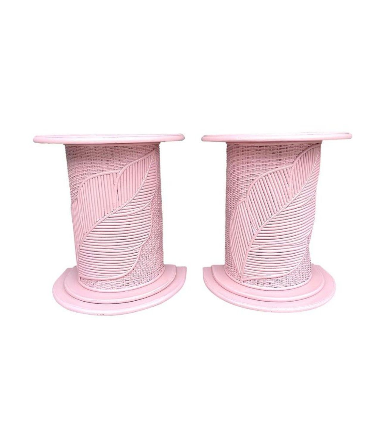 A pair of Italian 1960s dusty pink pencil reed, bamboo side tables / pedestals by Vivai del Sud each with a large leaf designs on the front. The semi circular tables sit well against the wall and could used as bedside tales too.