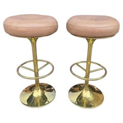 A pair of Italian 1970s gilt metal and leather bar stools